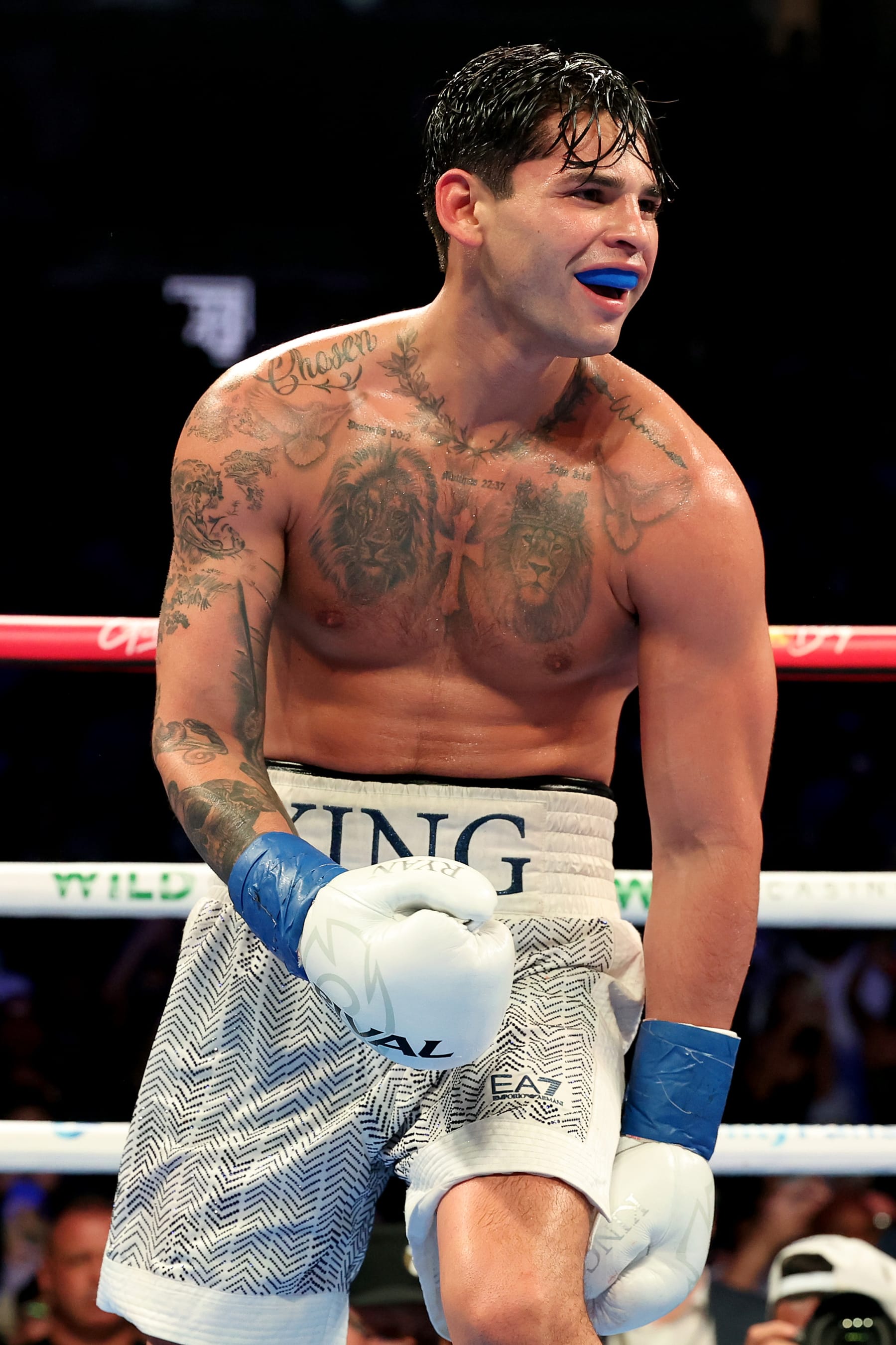NEW YORK, NEW YORK - APRIL 20: Ryan Garcia (white trunks) reacts against Devin Haney (gray trunks) during their WBC Super Lightweight title bout at Barclays Center on April 20, 2024 in New York City.  (Photo by Al Bello/Getty Images)