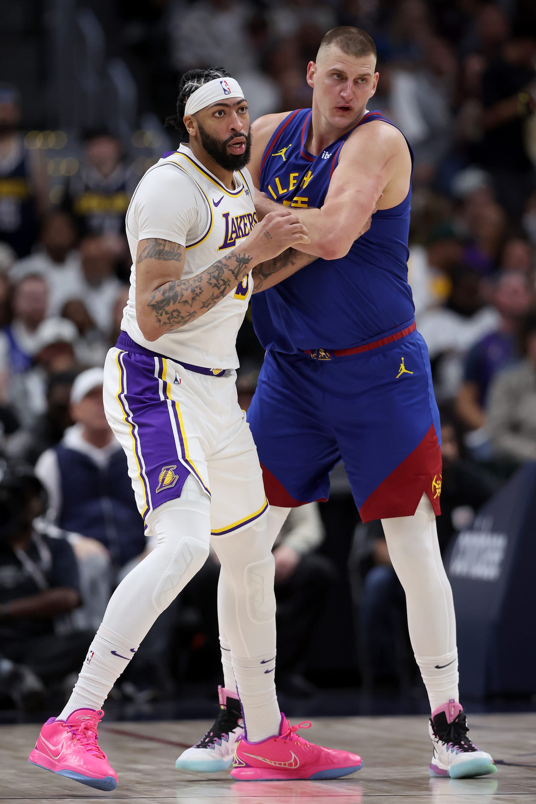DENVER, COLORADO - APRIL 20: Anthony Davis #3 of the Los Angeles Lakers  is guarded by Nikola Jokic #15 of the Denver Nuggets in the third quarter during game one of the Western Conference First Round Playoffs at Ball Arena on April 20, 2024 in Denver, Colorado.  NOTE TO USER: User expressly acknowledges and agrees that, by downloading and or using this photograph, User is consenting to the terms and conditions of the Getty Images License Agreement. (Photo by Matthew Stockman/Getty Images)