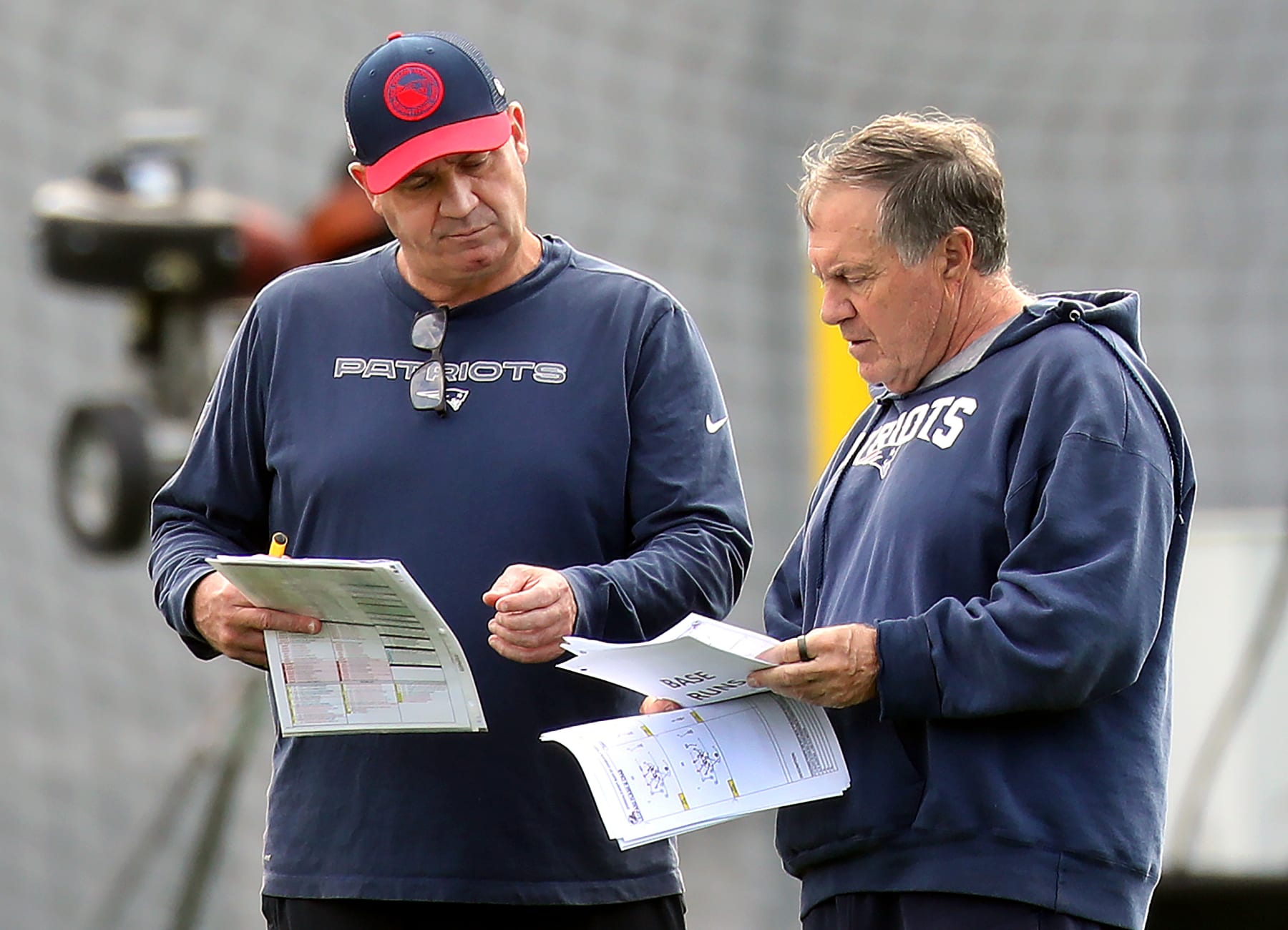 Foxborough, MA - September 27: New England Patriots head coach Bill Belichick and offensive coordinator Bill O'Brien review play sheets during practice. (Photo by John Tlumacki/The Boston Globe via Getty Images)