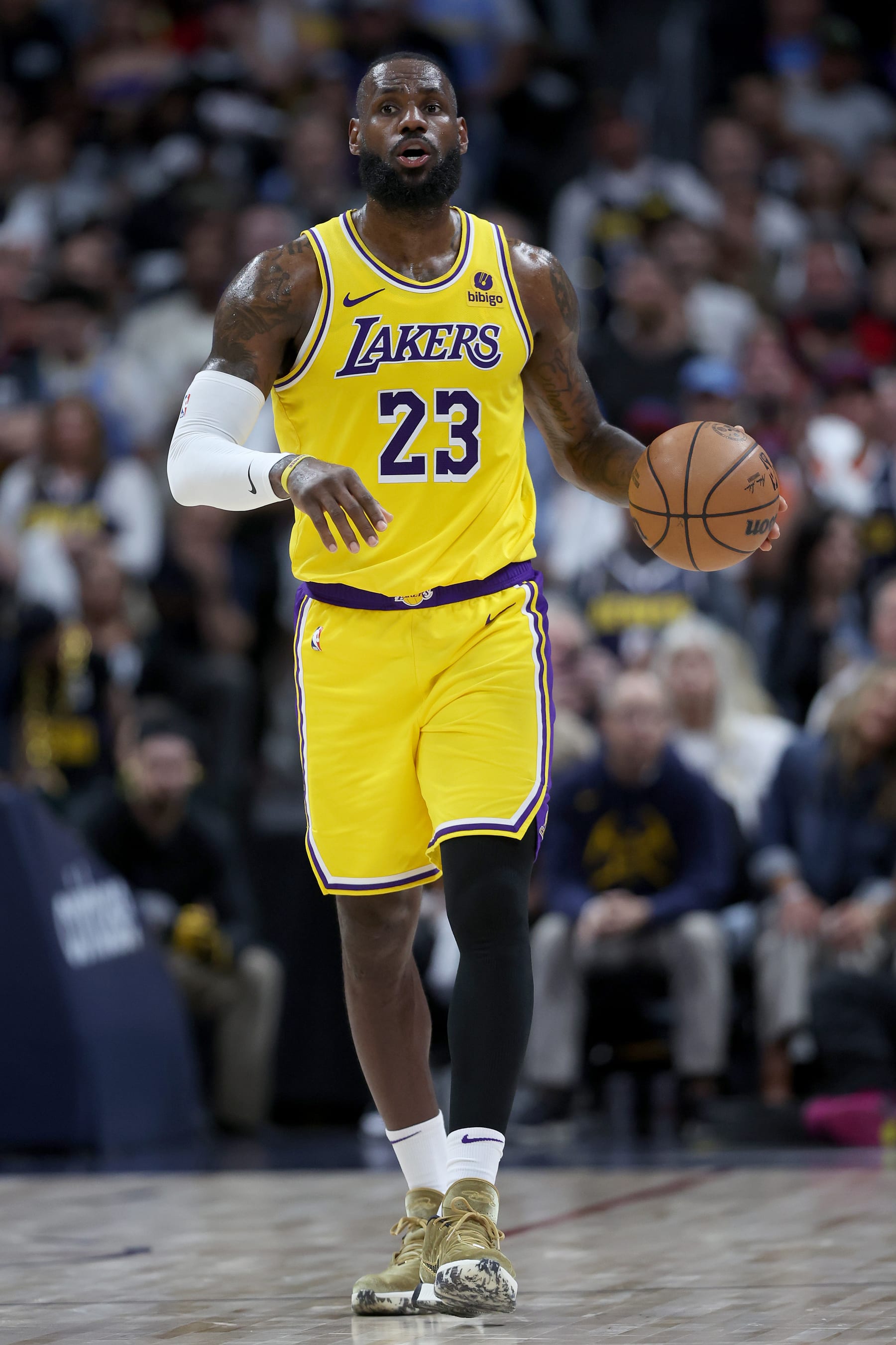 DENVER, COLORADO - APRIL 29: LeBron James #23 of the Los Angeles Lakers brings the ball down the court against the Denver Nuggets in the third quarter during game five of the Western Conference First Round Playoffs at Ball Arena on April 29, 2024 in Denver, Colorado. NOTE TO USER: User expressly acknowledges and agrees that, by downloading and or using this photograph, User is consenting to the terms and conditions of the Getty Images License Agreement.  (Photo by Matthew Stockman/Getty Images)