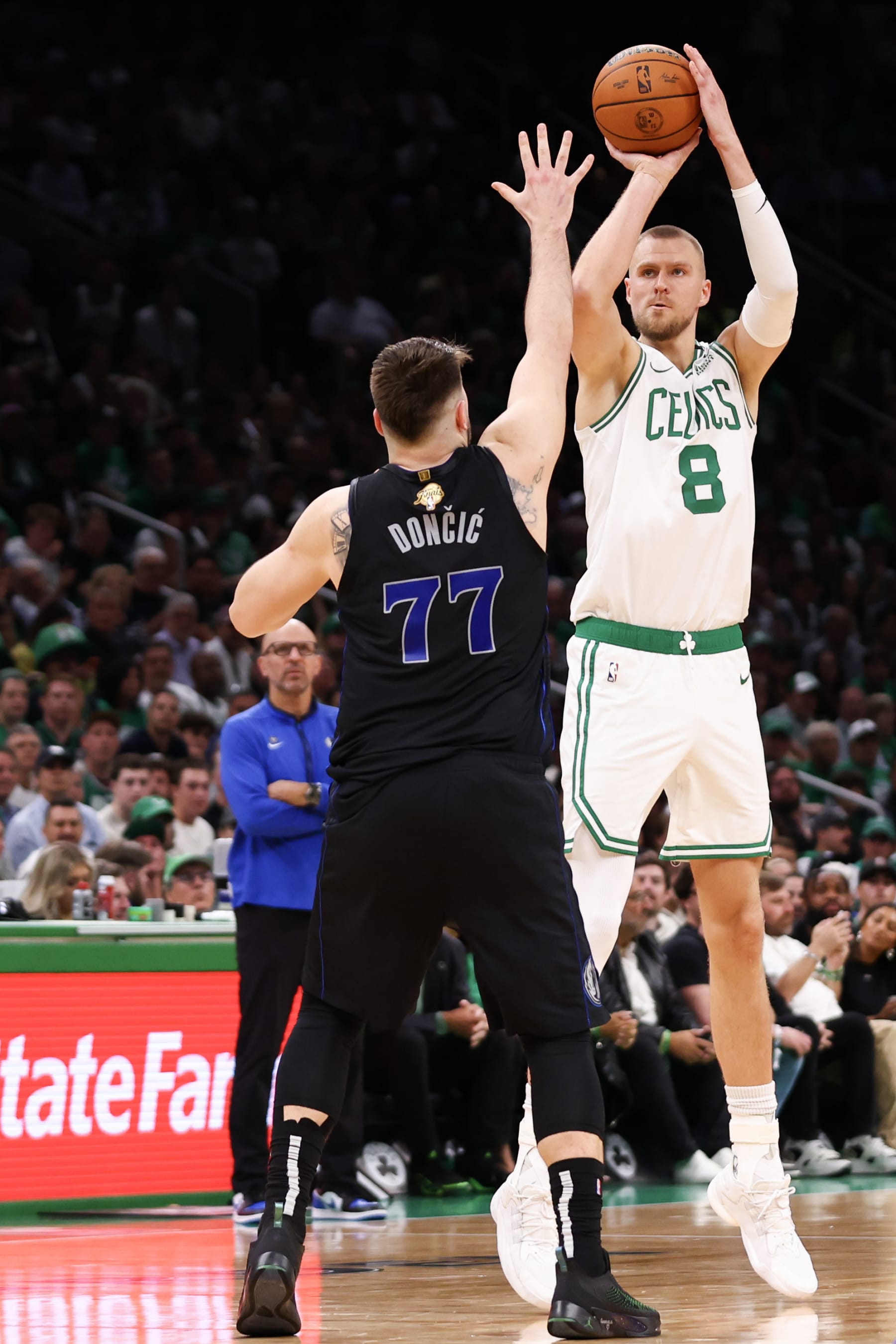 BOSTON, MASSACHUSETTS - JUNE 06: Kristaps Porzingis #8 of the Boston Celtics shoots the ball against Luka Doncic #77 of the Dallas Mavericks during the second quarter in Game One of the 2024 NBA Finals at TD Garden on June 06, 2024 in Boston, Massachusetts. NOTE TO USER: User expressly acknowledges and agrees that, by downloading and or using this photograph, User is consenting to the terms and conditions of the Getty Images License Agreement. (Photo by Maddie Meyer/Getty Images)