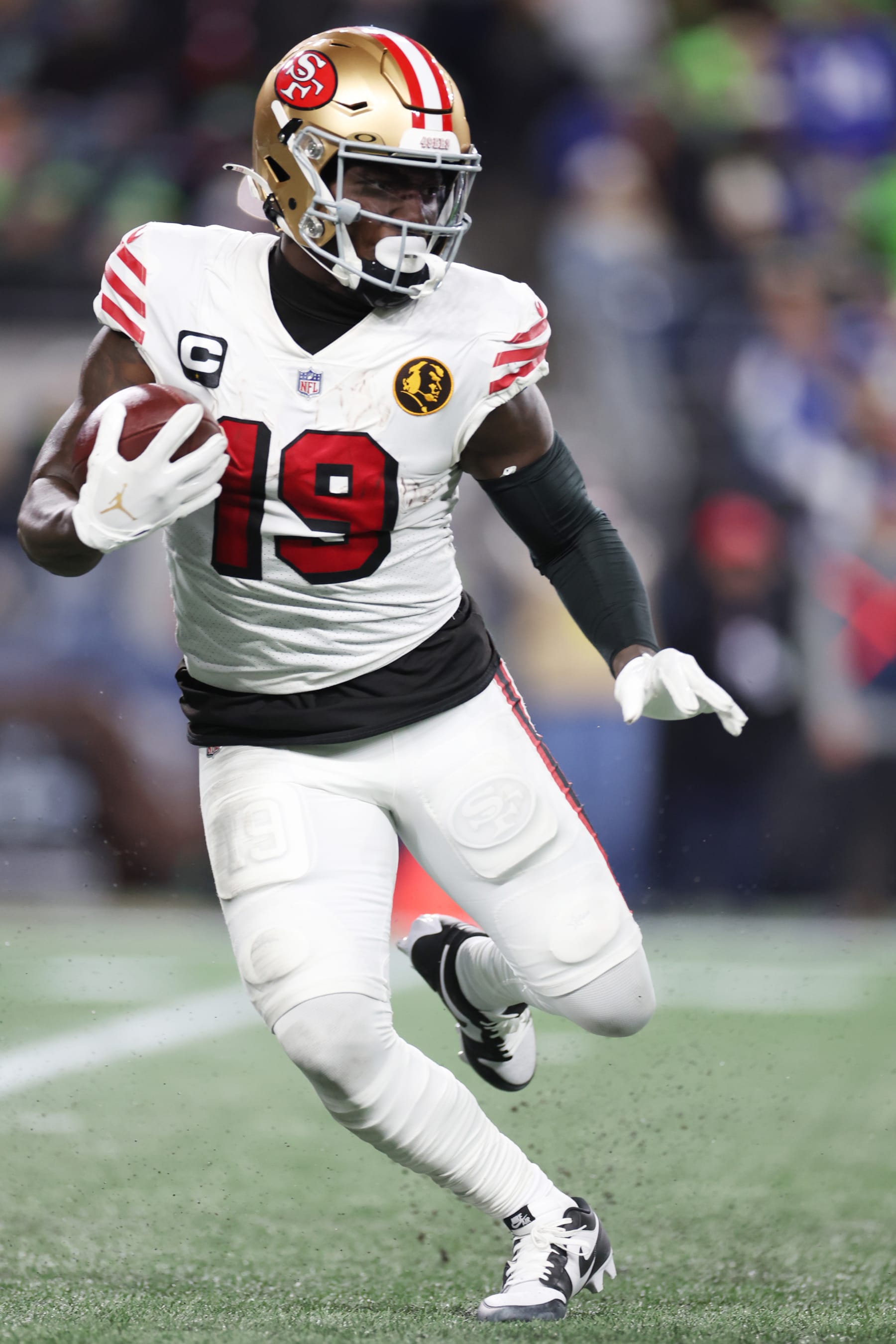 SEATTLE, WASHINGTON - NOVEMBER 23: Deebo Samuel #19 of the San Francisco 49ers runs with the ball  during the second quarter against the Seattle Seahawks at Lumen Field on November 23, 2023 in Seattle, Washington. (Photo by Steph Chambers/Getty Images)