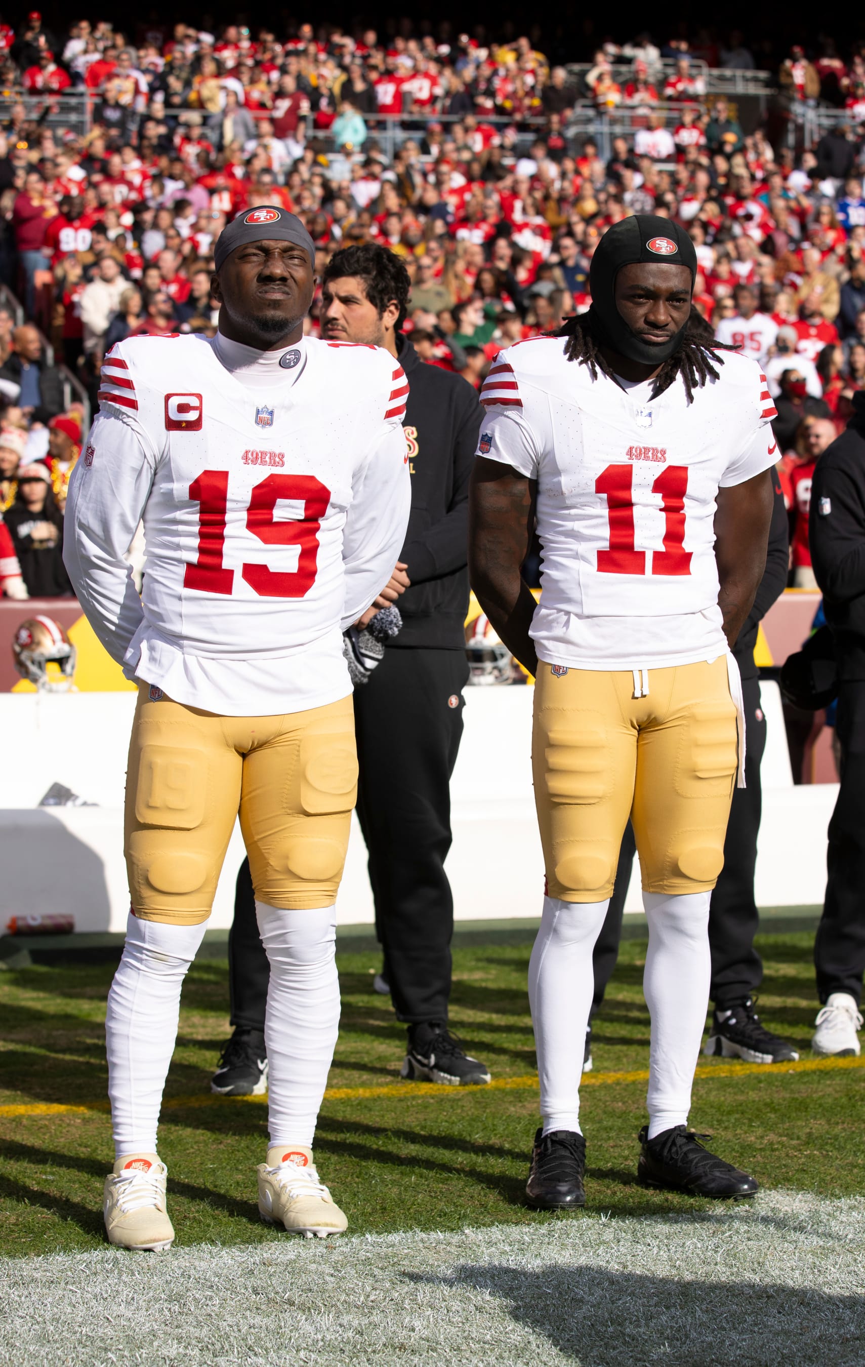 LANDOVER, MD - DECEMBER 31: Deebo Samuel #19 and Brandon Aiyuk #11 of the San Francisco 49ers on the sideline before the game against the Washington Commanders at FedEx Field on December 31, 2023 in Landover, Maryland. The 49ers defeated the Commanders 27-10. (Photo by Michael Zagaris/San Francisco 49ers/Getty Images)
