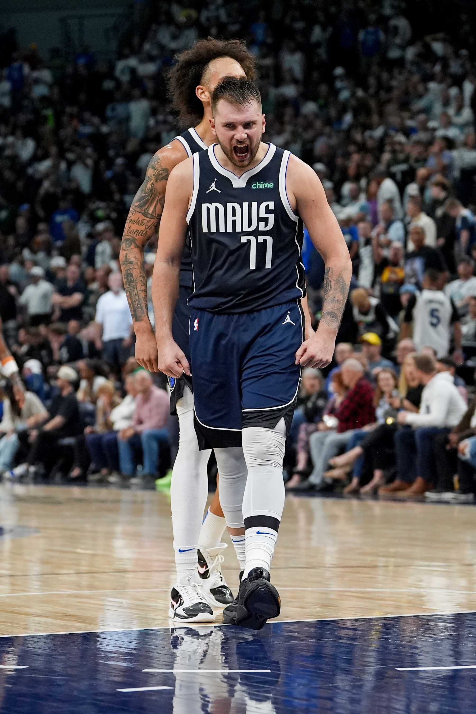 MINNEAPOLIS, MN -  OCTOBER 29: Luka Doncic #77 of the Dallas Mavericks celebrates during the game against the Minnesota Timberwolves on October 29, 2024 at Target Center in Minneapolis, Minnesota. NOTE TO USER: User expressly acknowledges and agrees that, by downloading and or using this Photograph, user is consenting to the terms and conditions of the Getty Images License Agreement. Mandatory Copyright Notice: Copyright 2024 NBAE (Photo by Jordan Johnson/NBAE via Getty Images)