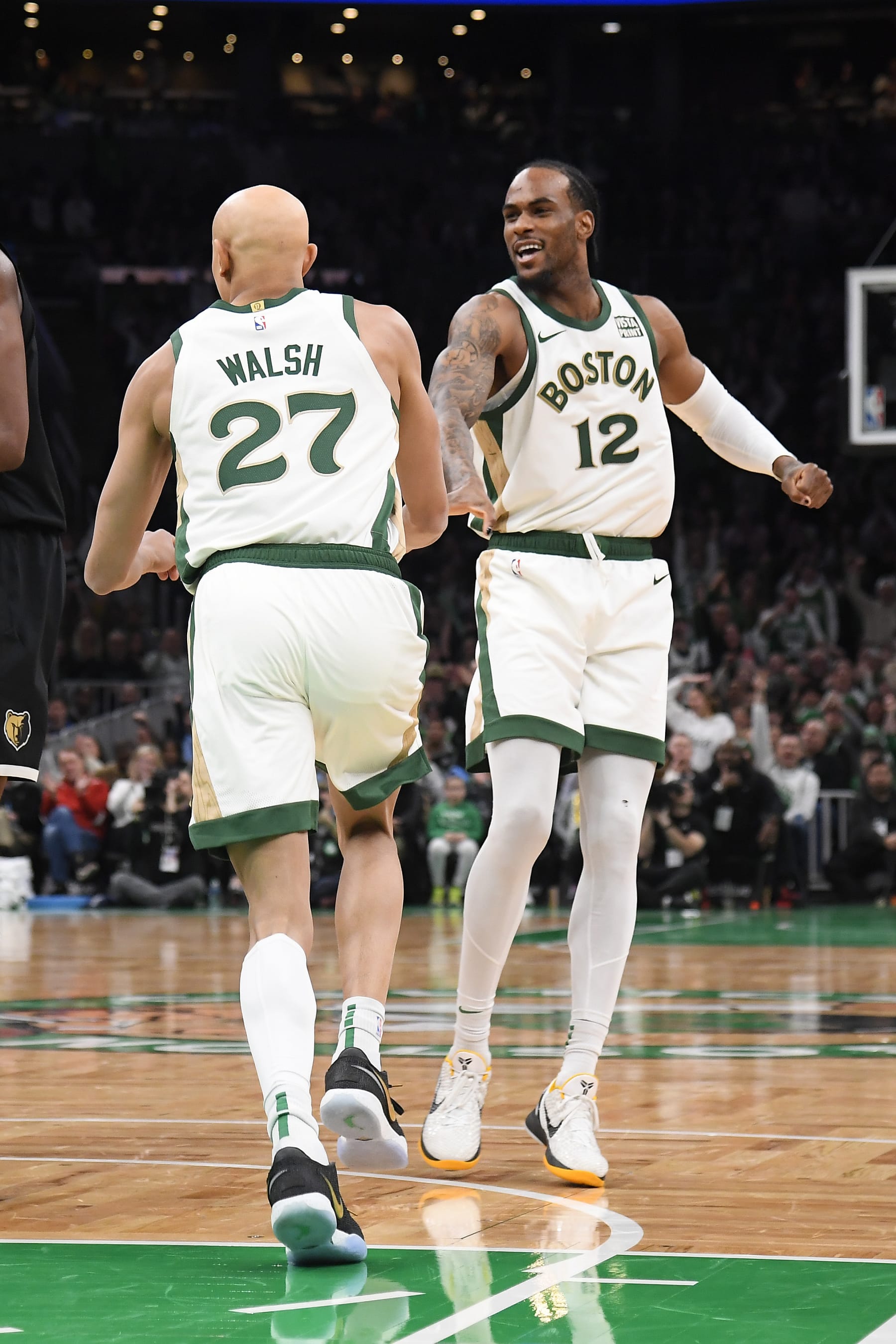 BOSTON, MA - FEBRUARY 4: Jordan Walsh #27 high five during the game Oshae Brissett #12 of the Boston Celtics during the game against the Memphis Grizzlies  on February 4, 2024 at the TD Garden in Boston, Massachusetts. NOTE TO USER: User expressly acknowledges and agrees that, by downloading and or using this photograph, User is consenting to the terms and conditions of the Getty Images License Agreement. Mandatory Copyright Notice: Copyright 2024 NBAE  (Photo by Brian Babineau/NBAE via Getty Images)