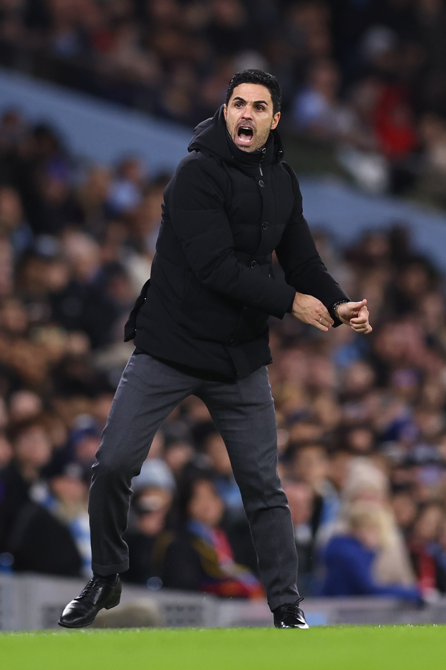 MANCHESTER, ENGLAND - JANUARY 27: Mikel Arteta the head coach / manager of Arsenal reacts during the Emirates FA Cup Fourth Round match between Manchester City and Arsenal at Etihad Stadium on January 27, 2023 in Manchester, England. (Photo by Robbie Jay Barratt - AMA/Getty Images)