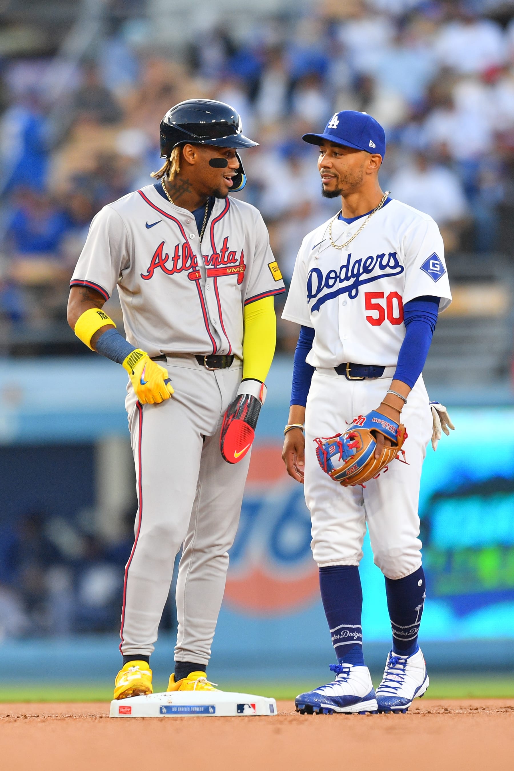 LOS ANGELES, CA - MAY 03: Atlanta Braves outfielder Ronald Acuna Jr. (13) talks with Los Angeles Dodgers shortstop Mookie Betts (50) during the MLB game between the Atlanta Braves and the Los Angeles Dodgers on May 3, 2024 at Dodger Stadium in Los Angeles, CA. (Photo by Brian Rothmuller/Icon Sportswire via Getty Images)