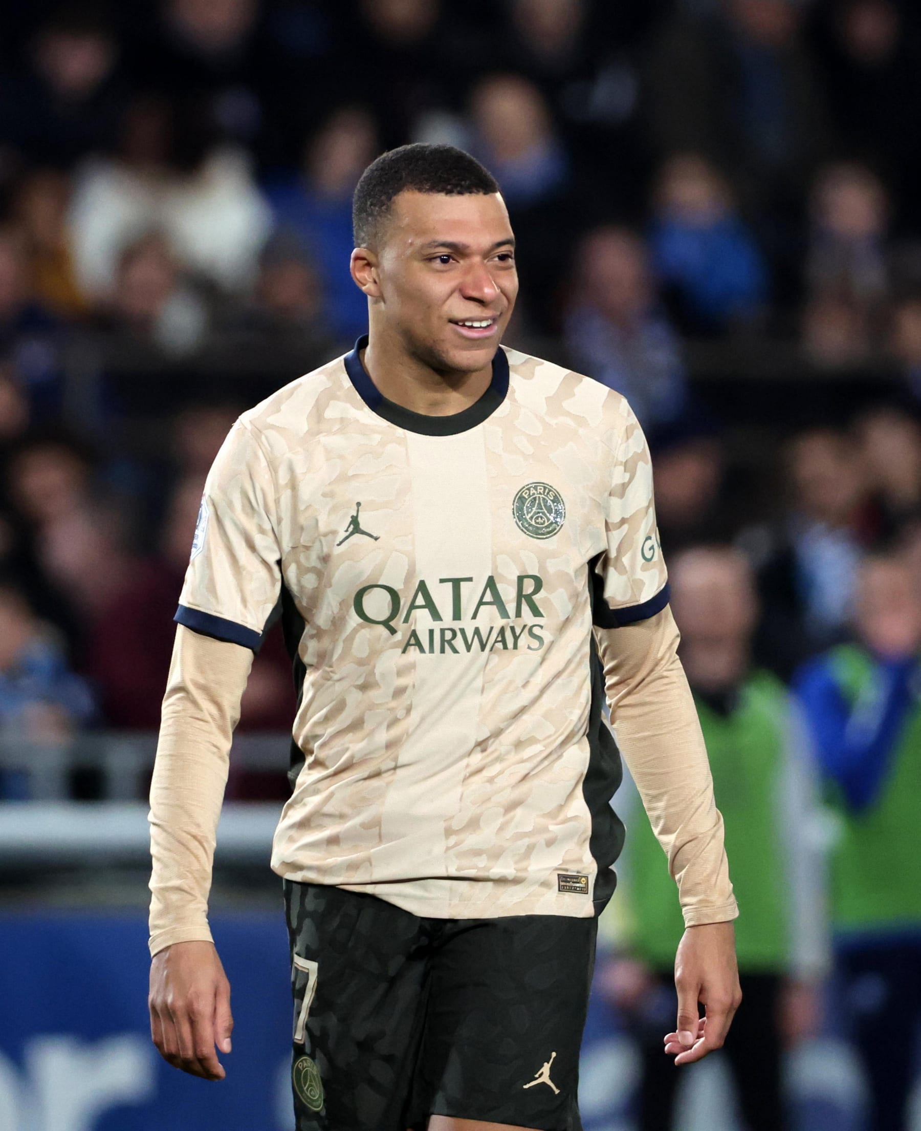 STRASBOURG, FRANCE - FEBRUARY 02: Kylian Mbappe #7 of Paris Saint-Germain reacts with fans of Strasbourg after his head injury during the Ligue 1 Uber Eats match between RC Strasbourg and Paris Saint-Germain at Stade de la Meinau on February 02, 2024 in Strasbourg, France. (Photo by Xavier Laine/Getty Images)