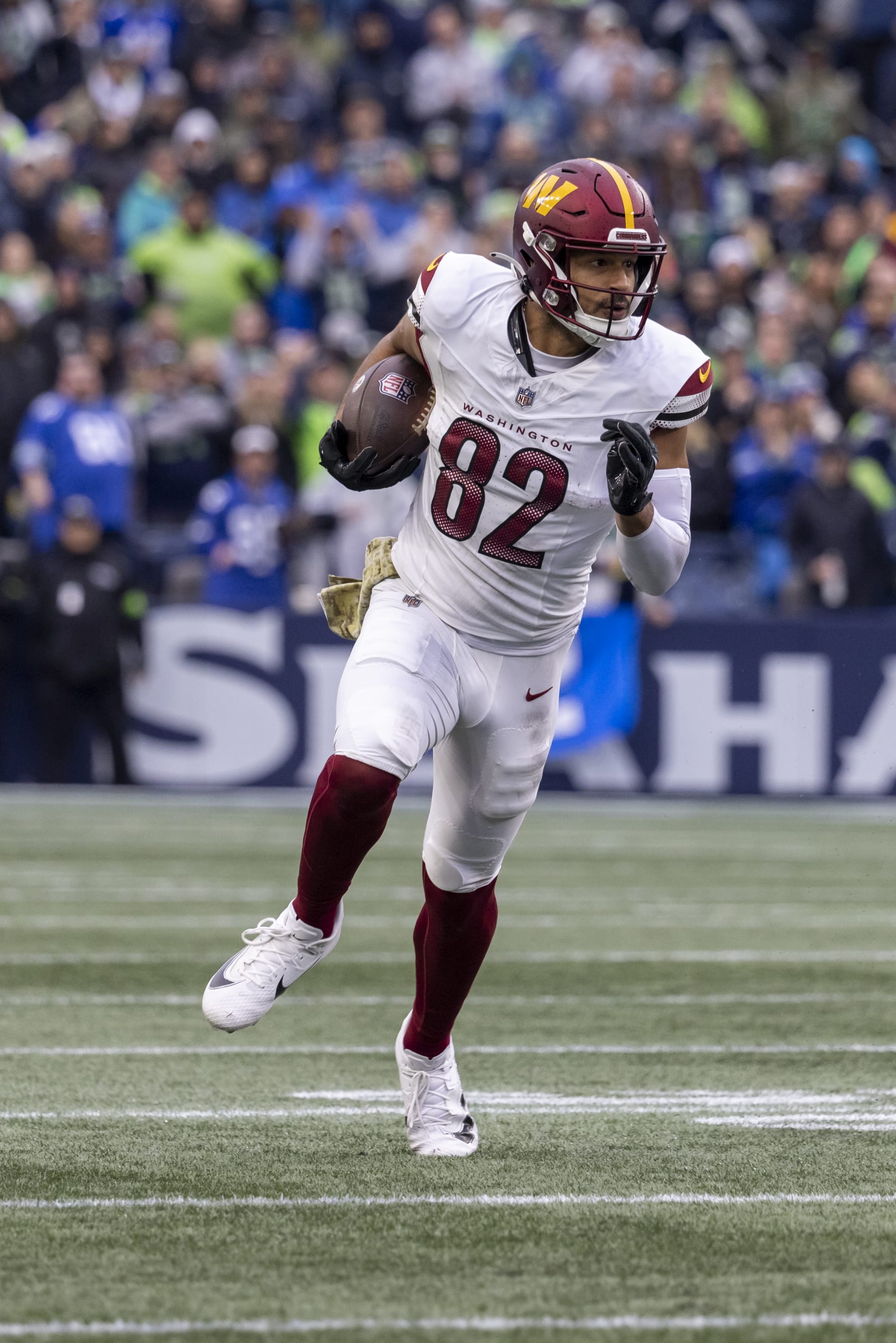SEATTLE, WASHINGTON - NOVEMBER 12: Logan Thomas #82 of the Washington Commanders  runs on the field against the Seattle Seahawks at Lumen Field on November 12, 2023 in Seattle, Washington. (Photo by Tom Hauck/Getty Images)