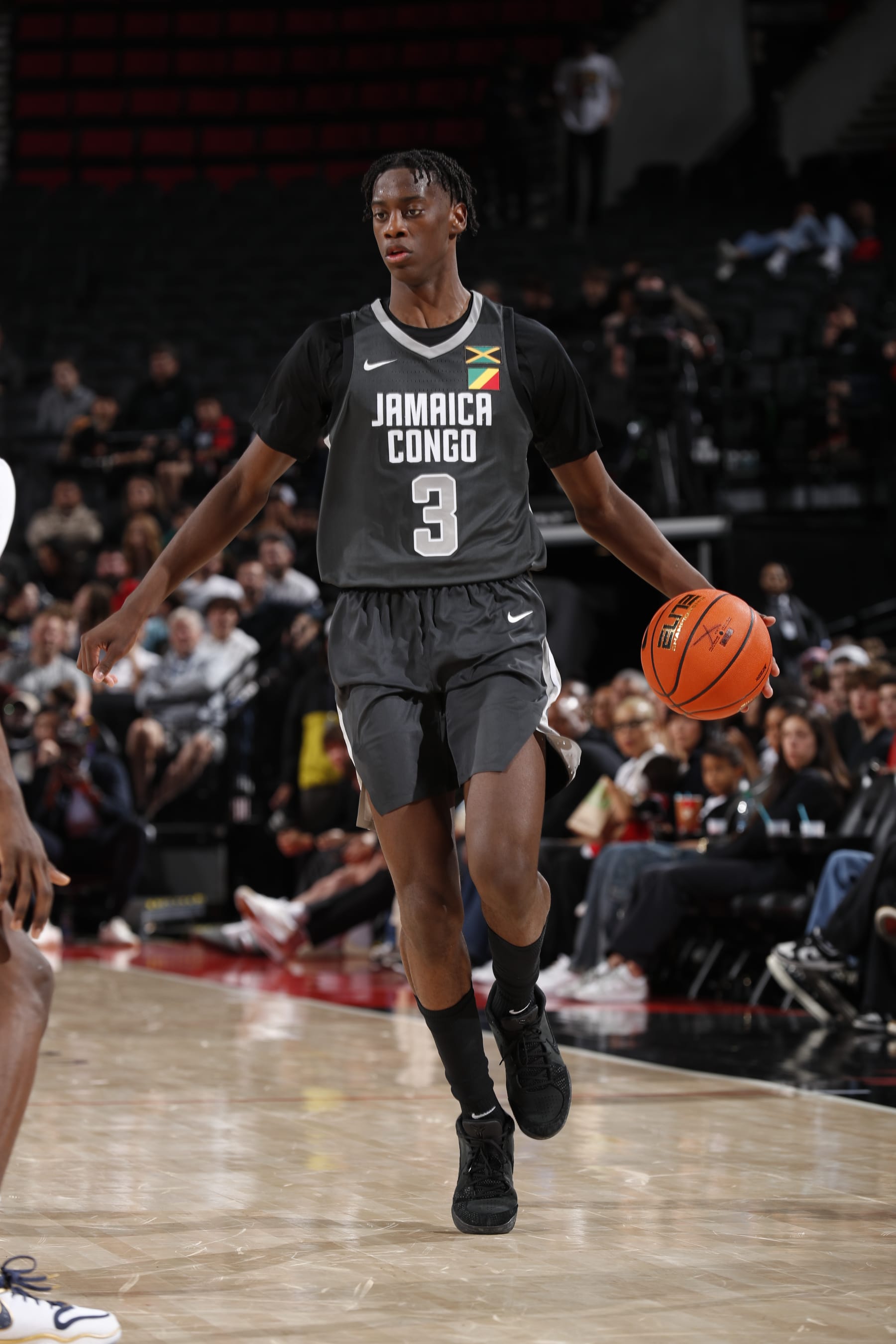 PORTLAND, OR - APRIL 13: AJ Dybantsa #3 of Team World dribbles the ball during the game against Team USA during the 2024 Nike Hoop Summit on April 13, 2024 at the Moda Center Arena in Portland, Oregon. NOTE TO USER: User expressly acknowledges and agrees that, by downloading and or using this photograph, user is consenting to the terms and conditions of the Getty Images License Agreement. Mandatory Copyright Notice: Copyright 2024 NBAE (Photo by Cameron Browne/NBAE via Getty Images)