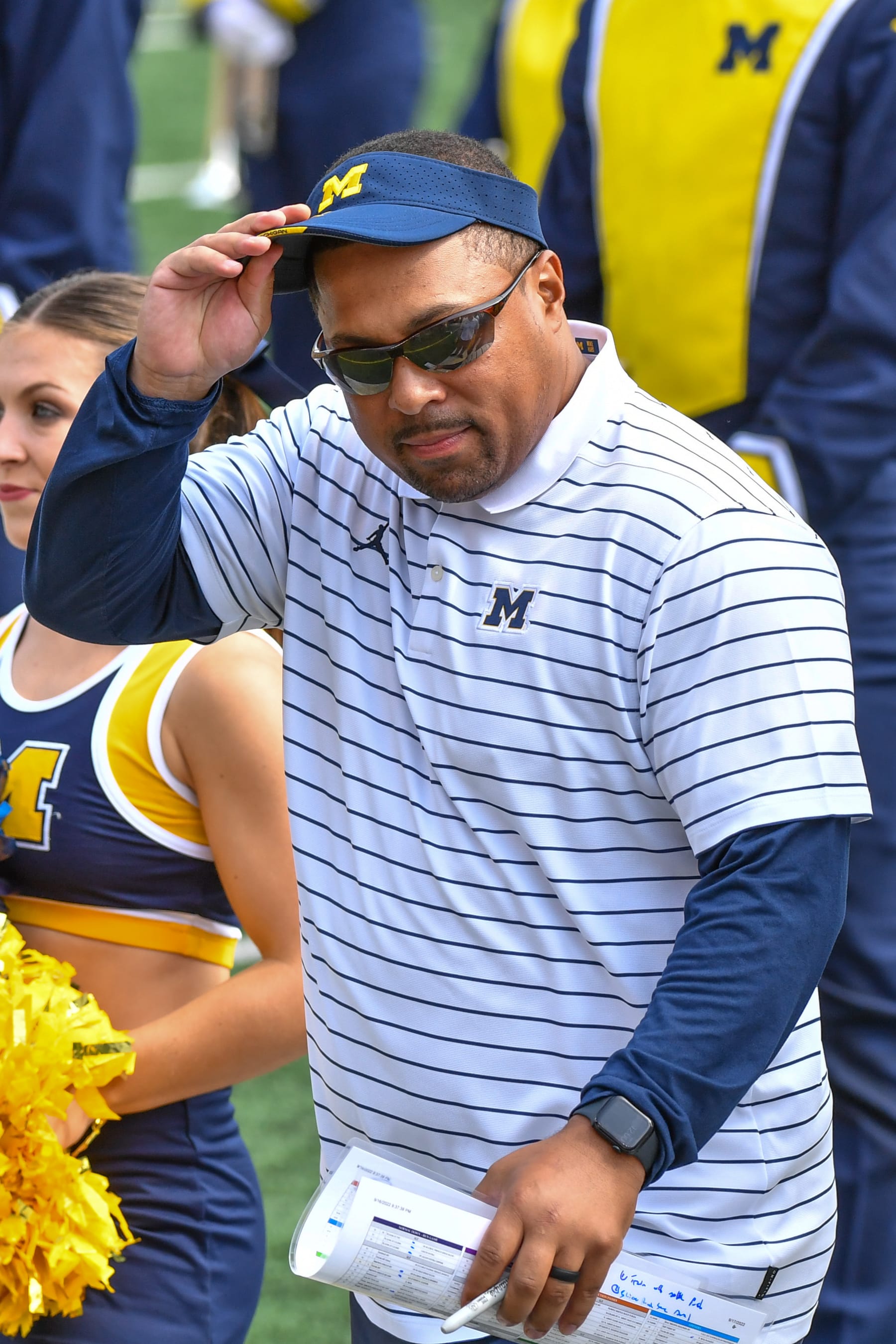 ANN ARBOR, MICHIGAN - SEPTEMBER 17:  Former Player / Current Assistant Coach Mike Hart of the Michigan Wolverines is seen on the sideline before a college football game against the Connecticut Huskies at Michigan Stadium on September 17, 2022 in Ann Arbor, Michigan. (Photo by Aaron J. Thornton/Getty Images)