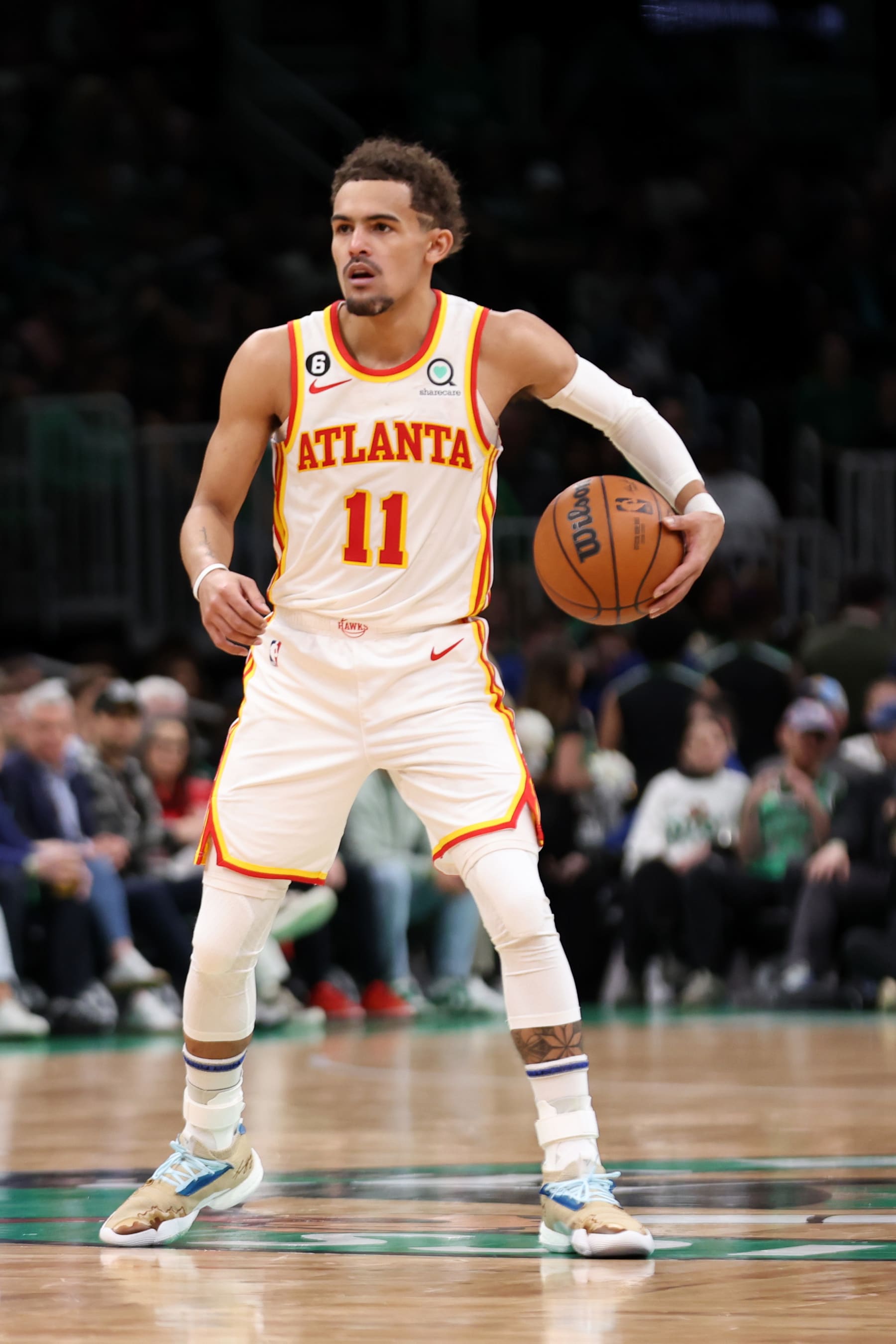 BOSTON, MASSACHUSETTS - APRIL 15: Trae Young #11 of the Atlanta Hawks dribbles during the second quarter of Game One of the Eastern Conference First Round Playoffs between the Boston Celtics and the Atlanta Hawks at TD Garden on April 15, 2023 in Boston, Massachusetts. NOTE TO USER: User expressly acknowledges and agrees that, by downloading and or using this photograph, User is consenting to the terms and conditions of the Getty Images License Agreement.  (Photo by Maddie Meyer/Getty Images)