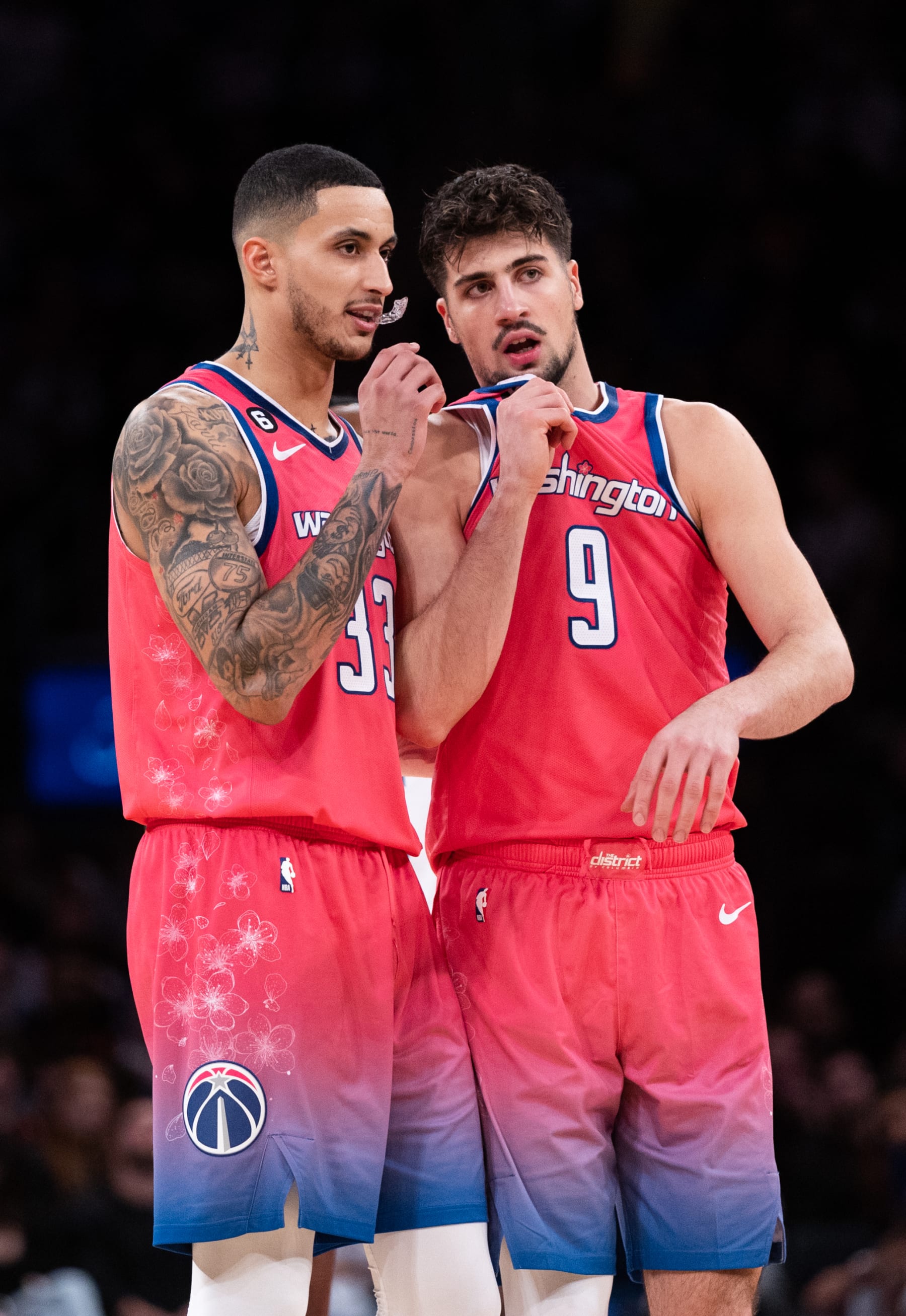 NEW YORK, NEW YORK - JANUARY 18: Kyle Kuzma #33 speaks with Deni Avdija #9 of the Washington Wizards during the third quarter of the game against the New York Knicks at Madison Square Garden on January 18, 2023 in New York City. NOTE TO USER: User expressly acknowledges and agrees that, by downloading and or using this photograph, User is consenting to the terms and conditions of the Getty Images License Agreement. (Photo by Dustin Satloff/Getty Images)