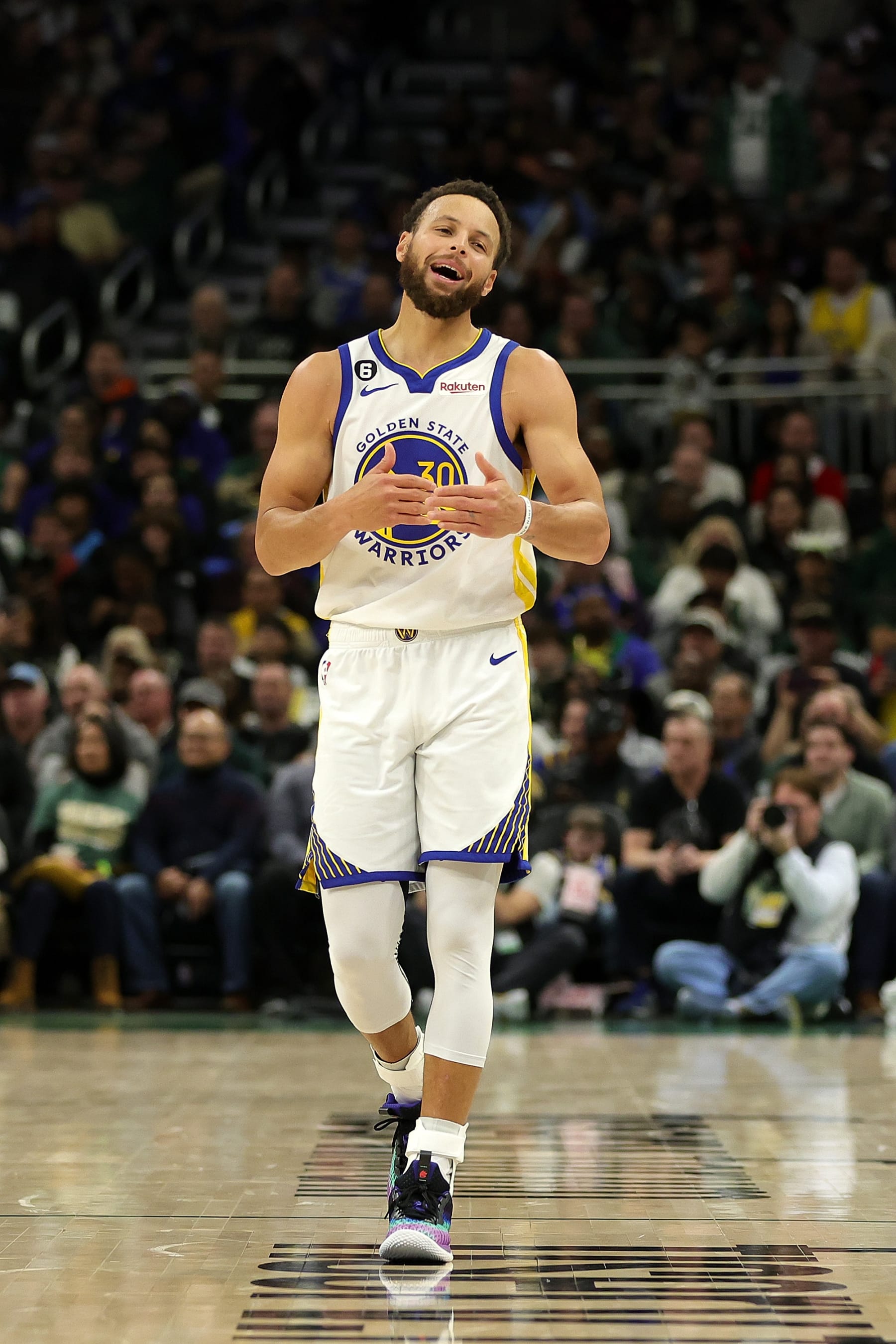 MILWAUKEE, WISCONSIN - DECEMBER 13: Stephen Curry #30 of the Golden State Warriors walks backcourt during a game against the Milwaukee Bucks at Fiserv Forum on December 13, 2022 in Milwaukee, Wisconsin. The Bucks defeated the Warriors 128-111. NOTE TO USER: User expressly acknowledges and agrees that, by downloading and or using this photograph, User is consenting to the terms and conditions of the Getty Images License Agreement. (Photo by Stacy Revere/Getty Images)