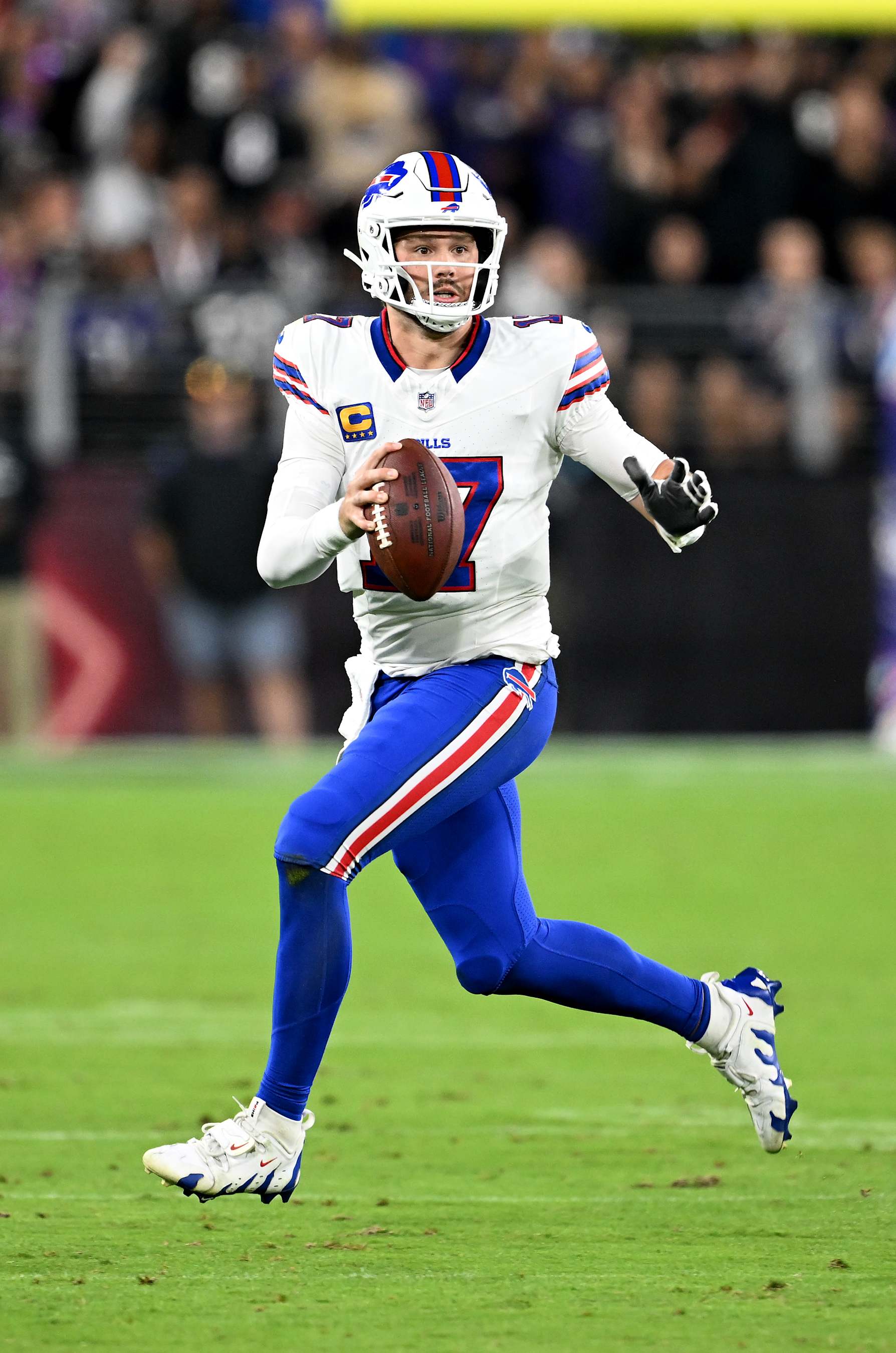 BALTIMORE, MARYLAND - SEPTEMBER 29: Josh Allen #17 of the Buffalo Bills rolls out of the pocket against the Baltimore Ravens at M&T Bank Stadium on September 29, 2024 in Baltimore, Maryland. (Photo by G Fiume/Getty Images)