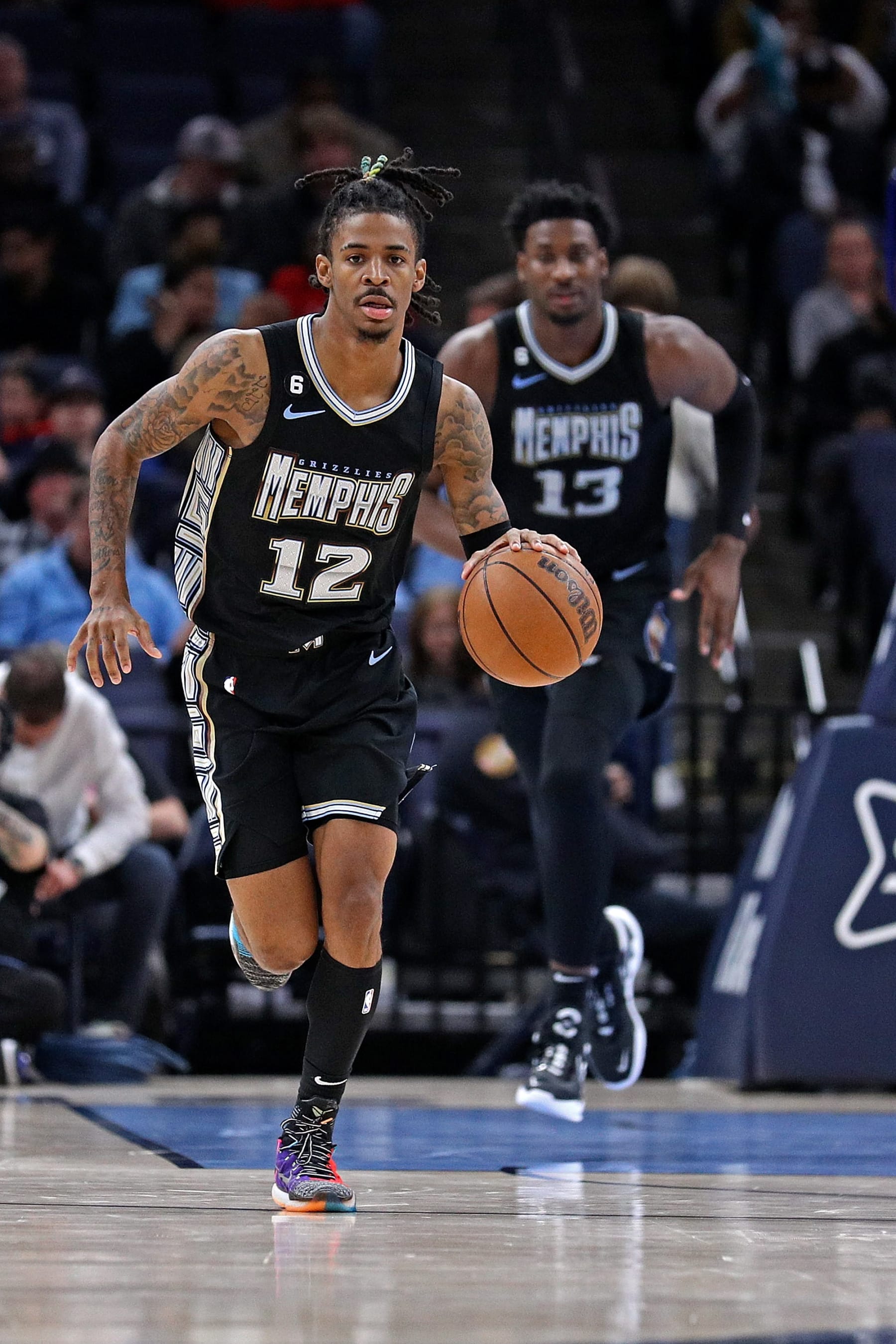 MEMPHIS, TENNESSEE - NOVEMBER 25: Ja Morant #12 of the Memphis Grizzlies brings the ball up court during the game against the New Orleans Pelicans at FedExForum on November 25, 2022 in Memphis, Tennessee. NOTE TO USER: User expressly acknowledges and agrees that, by downloading and or using this photograph, User is consenting to the terms and conditions of the Getty Images License Agreement. (Photo by Justin Ford/Getty Images)