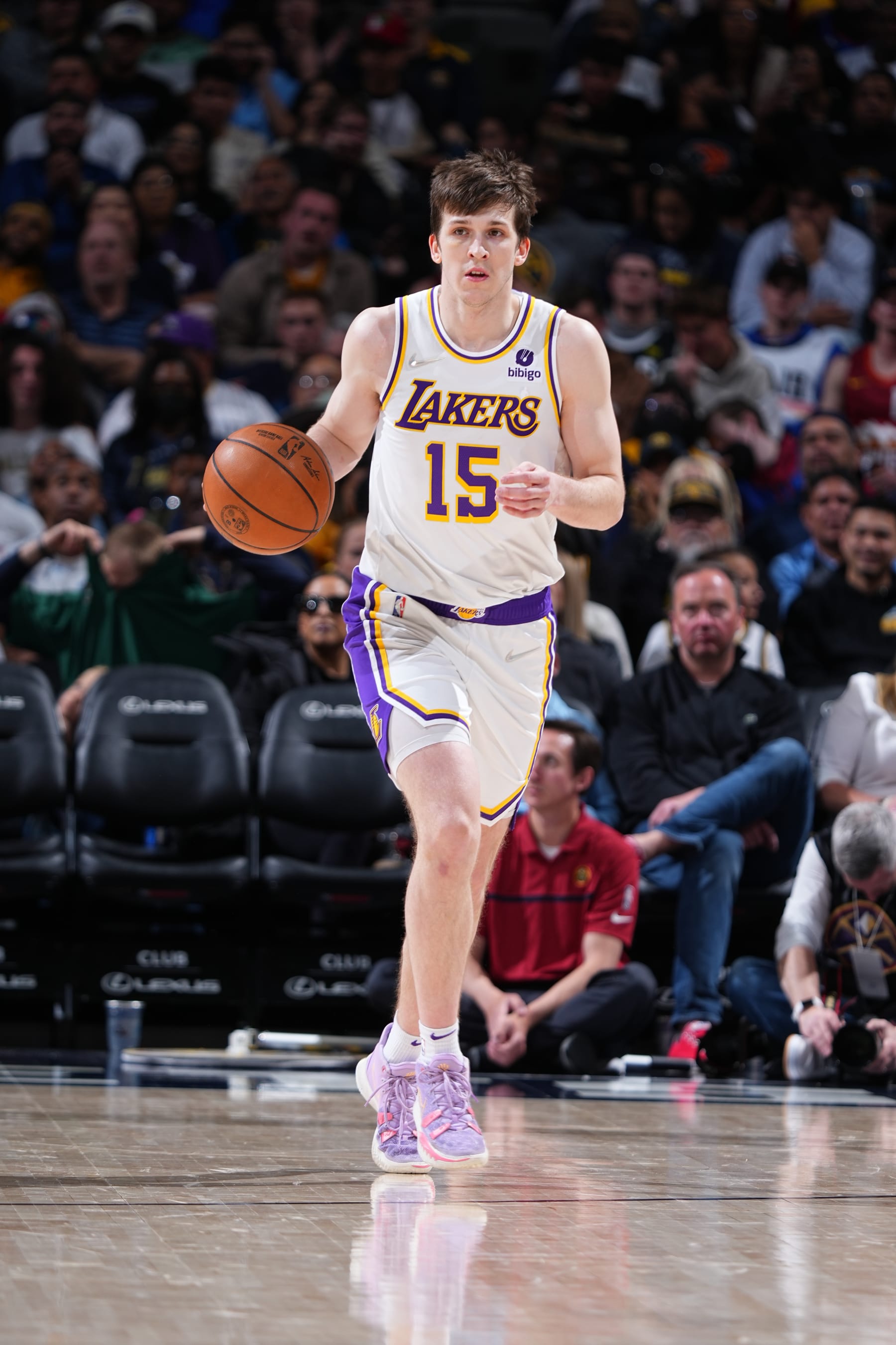 DENVER, CO - APRIL 10: Austin Reaves #15 of the Los Angeles Lakers dribbles the ball during the game against the Denver Nuggets on April 10, 2022 at the Ball Arena in Denver, Colorado. NOTE TO USER: User expressly acknowledges and agrees that, by downloading and/or using this Photograph, user is consenting to the terms and conditions of the Getty Images License Agreement. Mandatory Copyright Notice: Copyright 2022 NBAE (Photo by Garrett Ellwood/NBAE via Getty Images) DENVER, CO - APRIL 10: Austin Reaves #15 of the Los Angeles Lakers dribbles the ball during the game against the Denver Nuggets on April 10, 2022 at the Ball Arena in Denver, Colorado. NOTE TO USER: User expressly acknowledges and agrees that, by downloading and/or using this Photograph, user is consenting to the terms and conditions of the Getty Images License Agreement. Mandatory Copyright Notice: Copyright 2022 NBAE (Photo by Garrett Ellwood/NBAE via Getty Images)