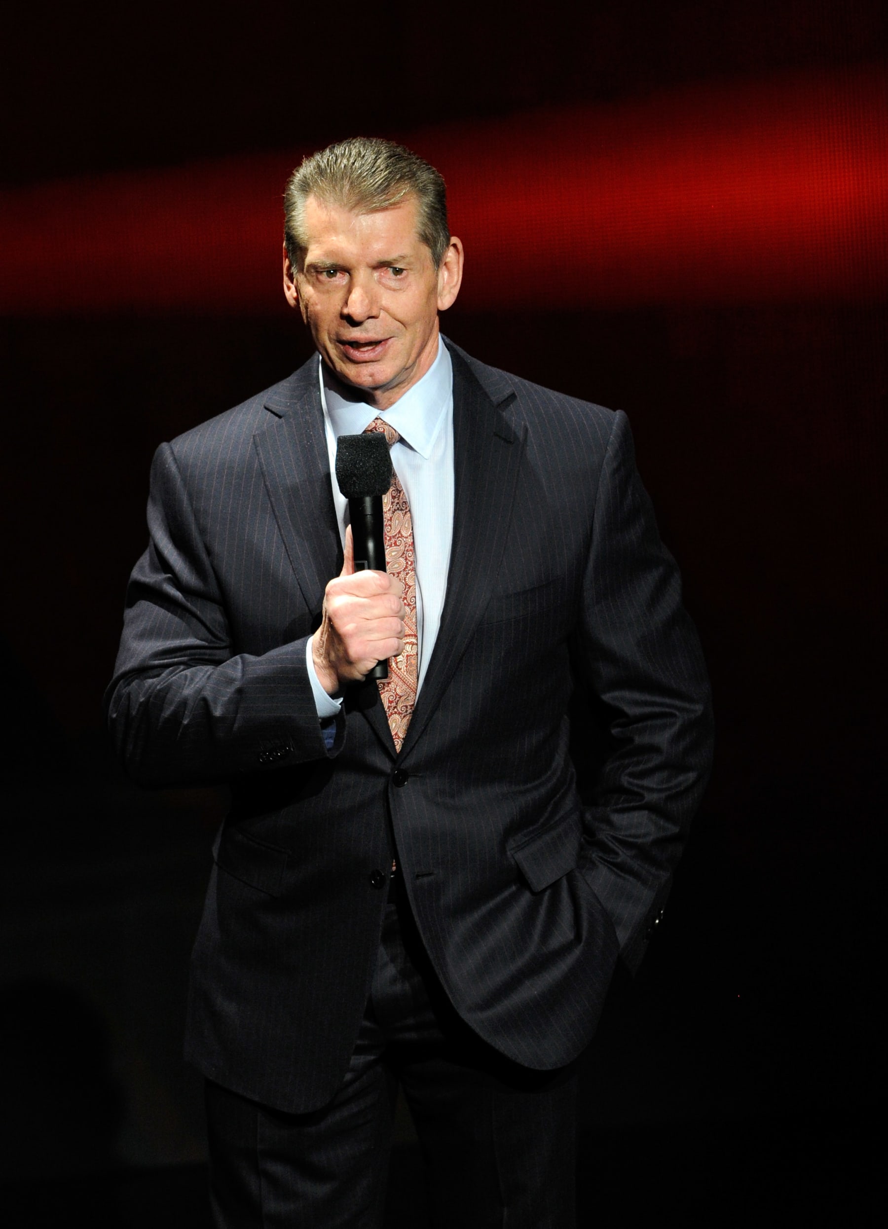 LAS VEGAS, NV - JANUARY 08:  WWE Chairman and CEO Vince McMahon speaks at a news conference announcing the WWE Network at the 2014 International CES at the Encore Theater at Wynn Las Vegas on January 8, 2014 in Las Vegas, Nevada. The network will launch on February 24, 2014 as the first-ever 24/7 streaming network, offering both scheduled programs and video on demand. The USD 9.99 per month subscription will include access to all 12 live WWE pay-per-view events each year. CES, the world's largest annual consumer technology trade show, runs through January 10 and is expected to feature 3,200 exhibitors showing off their latest products and services to about 150,000 attendees.  (Photo by Ethan Miller/Getty Images)