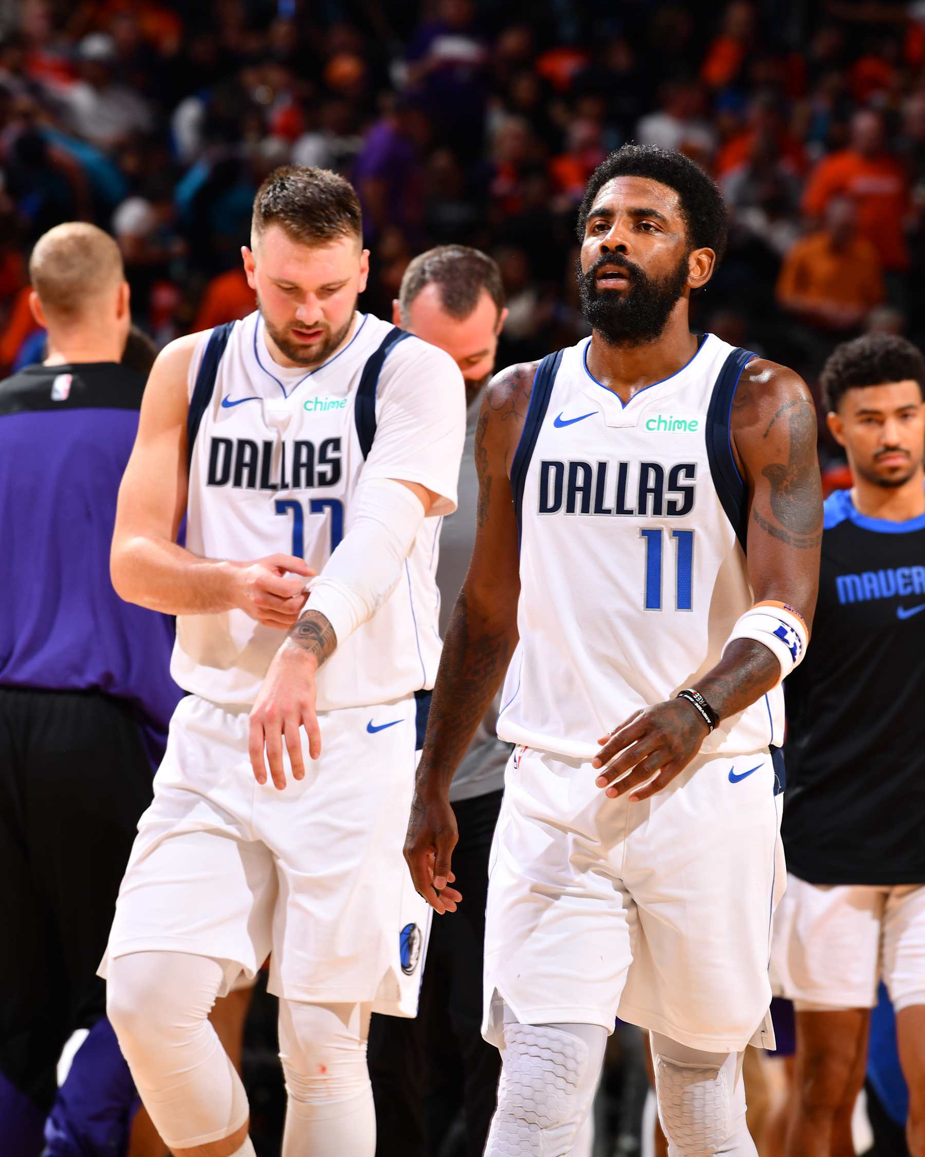 PHOENIX, AZ - OCTOBER 26: Luka Doncic #77 and Kyrie Irving #11 of the Dallas Mavericks looks on during the game against the Phoenix Suns on October 26, 2024 at Footprint Center in Phoenix, Arizona. NOTE TO USER: User expressly acknowledges and agrees that, by downloading and or using this photograph, user is consenting to the terms and conditions of the Getty Images License Agreement. Mandatory Copyright Notice: Copyright 2024 NBAE (Photo by Barry Gossage/NBAE via Getty Images)
