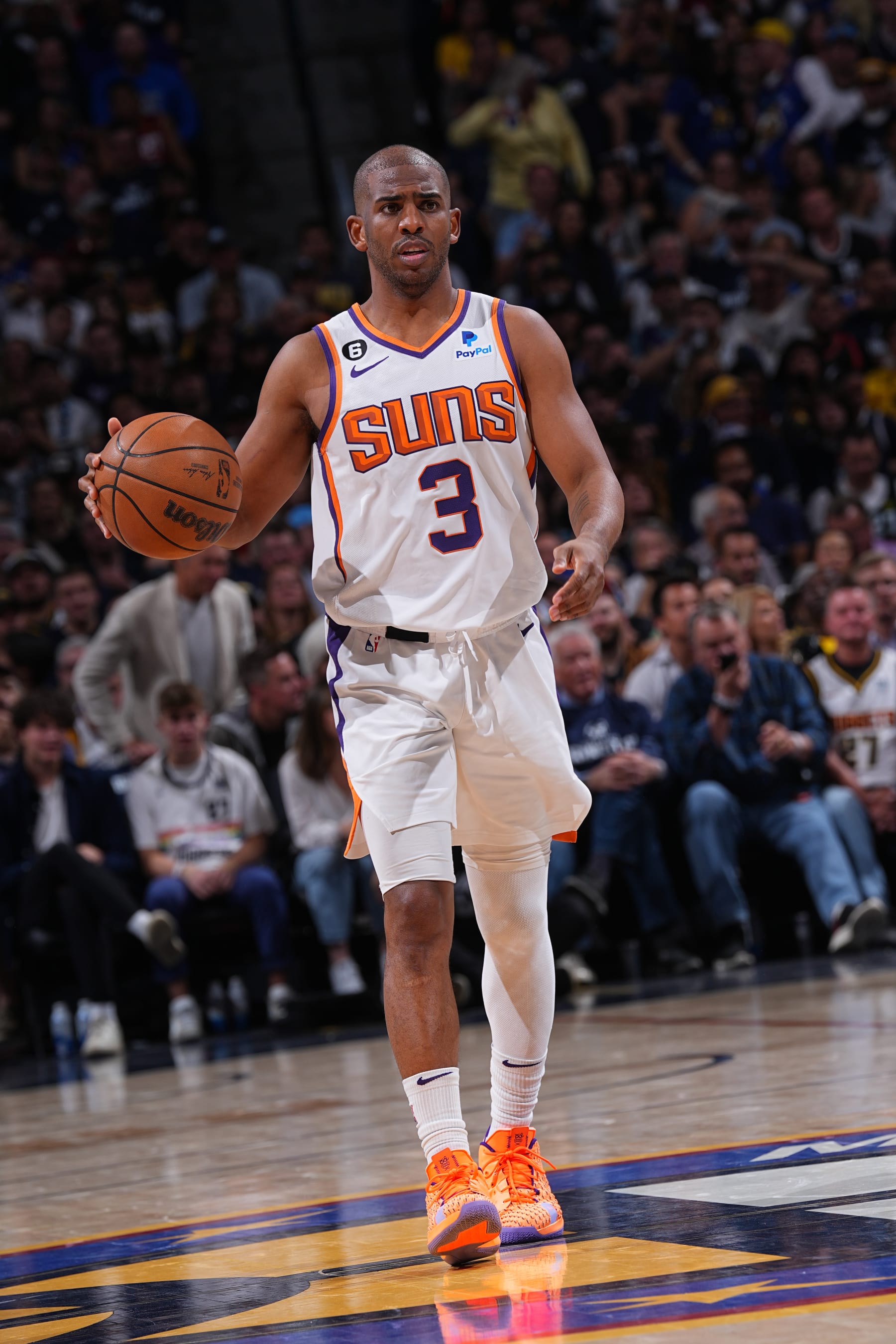 DENVER, CO - APRIL 29: Chris Paul #3 of the Phoenix Suns dribbles the ball during Game One of the Western Conference Semi-Finals of the 2023 NBA Playoffs against the Denver Nuggets on April 29, 2023 at the Ball Arena in Denver, Colorado. NOTE TO USER: User expressly acknowledges and agrees that, by downloading and/or using this Photograph, user is consenting to the terms and conditions of the Getty Images License Agreement. Mandatory Copyright Notice: Copyright 2023 NBAE (Photo by Bart Young/NBAE via Getty Images)