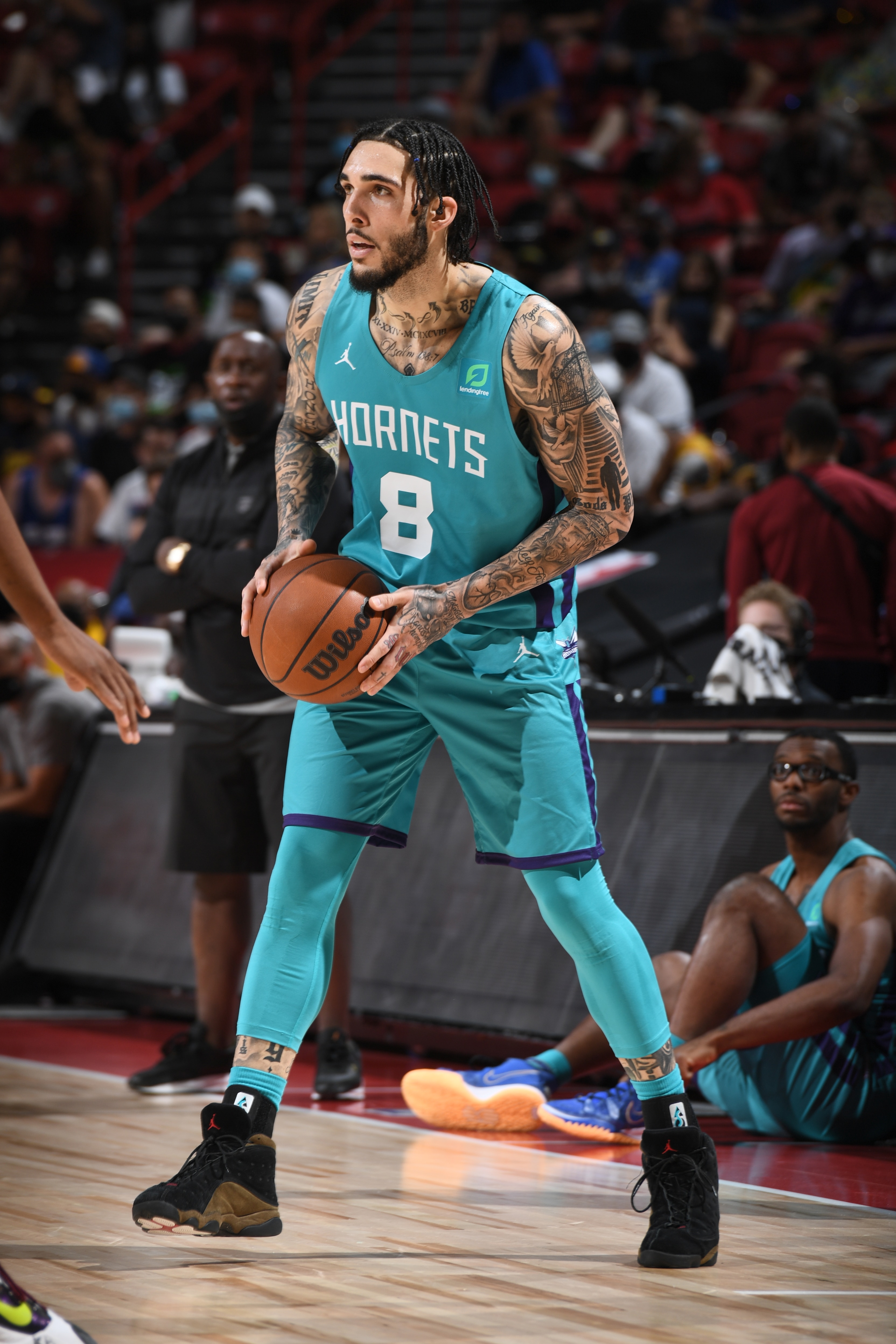 LAS VEGAS, NV - AUGUST 9: LiAngelo Ball #8 of Charlotte Hornets handles the ball during the game against the Sacramento Kings during the 2021 Las Vegas Summer League on August 9, 2021 at the Thomas & Mack Center in Las Vegas, Nevada. NOTE TO USER: User expressly acknowledges and agrees that, by downloading and/or using this Photograph, user is consenting to the terms and conditions of the Getty Images License Agreement. Mandatory Copyright Notice: Copyright 2021 NBAE (Photo by Garrett Ellwood/NBAE via Getty Images)