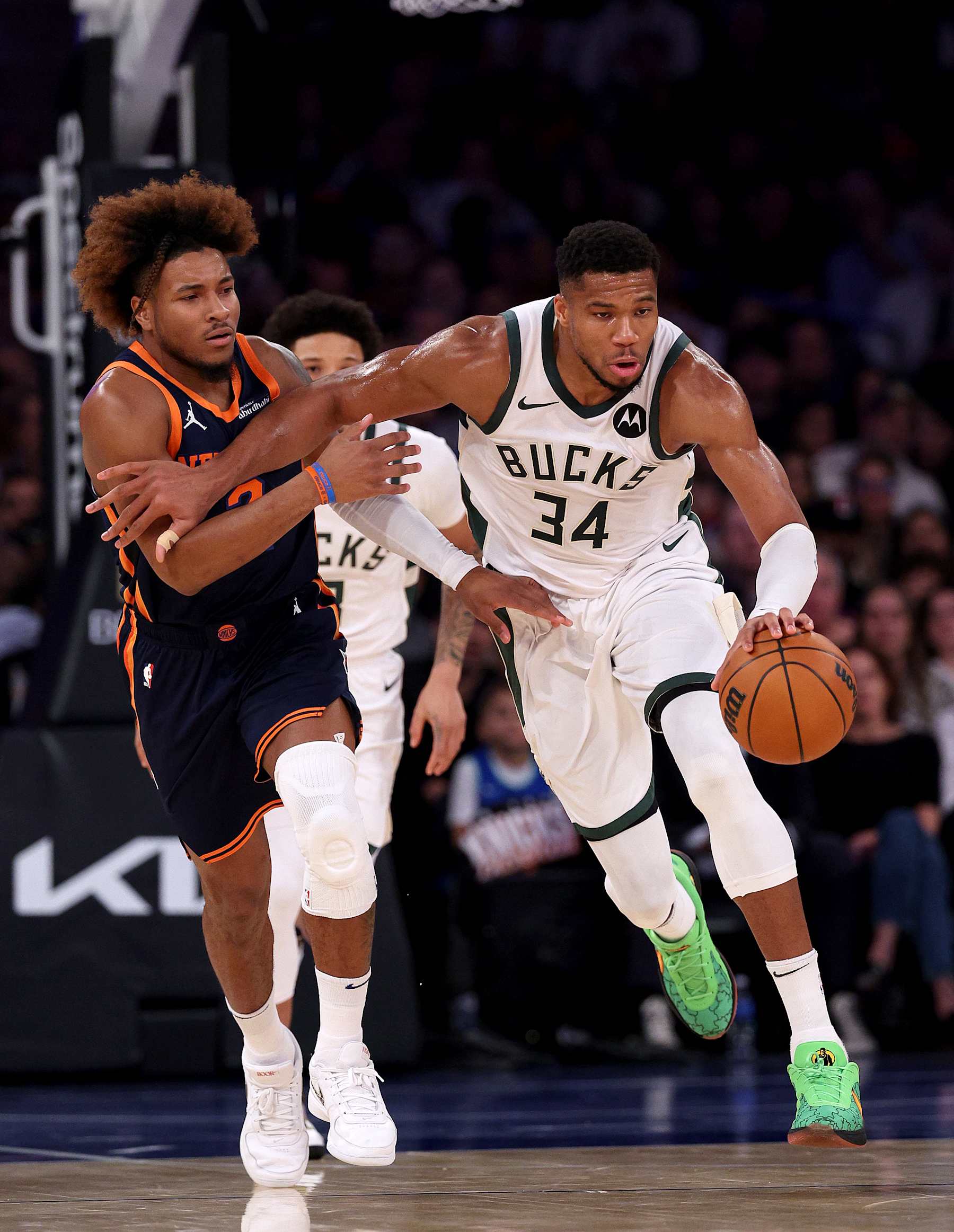 NEW YORK, NEW YORK - NOVEMBER 08:  Giannis Antetokounmpo #34 of the Milwaukee Bucks heads down court as Miles McBride #2 of the New York Knicks defends in the first half at Madison Square Garden on November 08, 2024 in New York City. NOTE TO USER: User expressly acknowledges and agrees that, by downloading and or using this photograph, User is consenting to the terms and conditions of the Getty Images License Agreement. (Photo by Elsa/Getty Images)