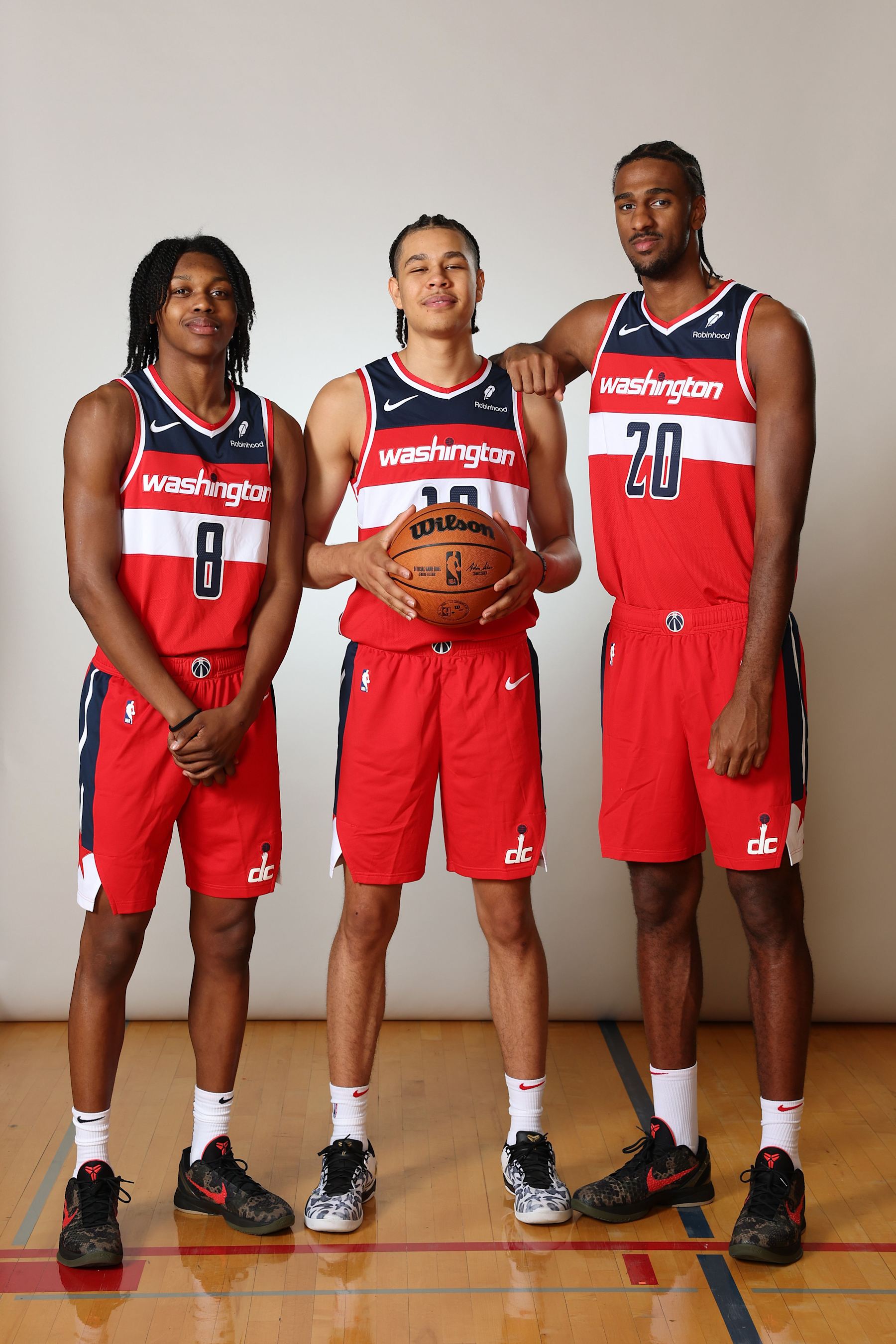 LAS VEGAS, NEVADA - JULY 17: (L-R) Carlton Carrington #17 of the Washington Wizards, Kyshawn George #18 of the Washington Wizards and Alexandre Sarr #12 of the Washington Wizards pose for a portrait during the 2024 NBA Rookie Photo Shoot at UNLV on July 17, 2024 in Las Vegas, Nevada.  (Photo by Monica Schipper/Getty Images)