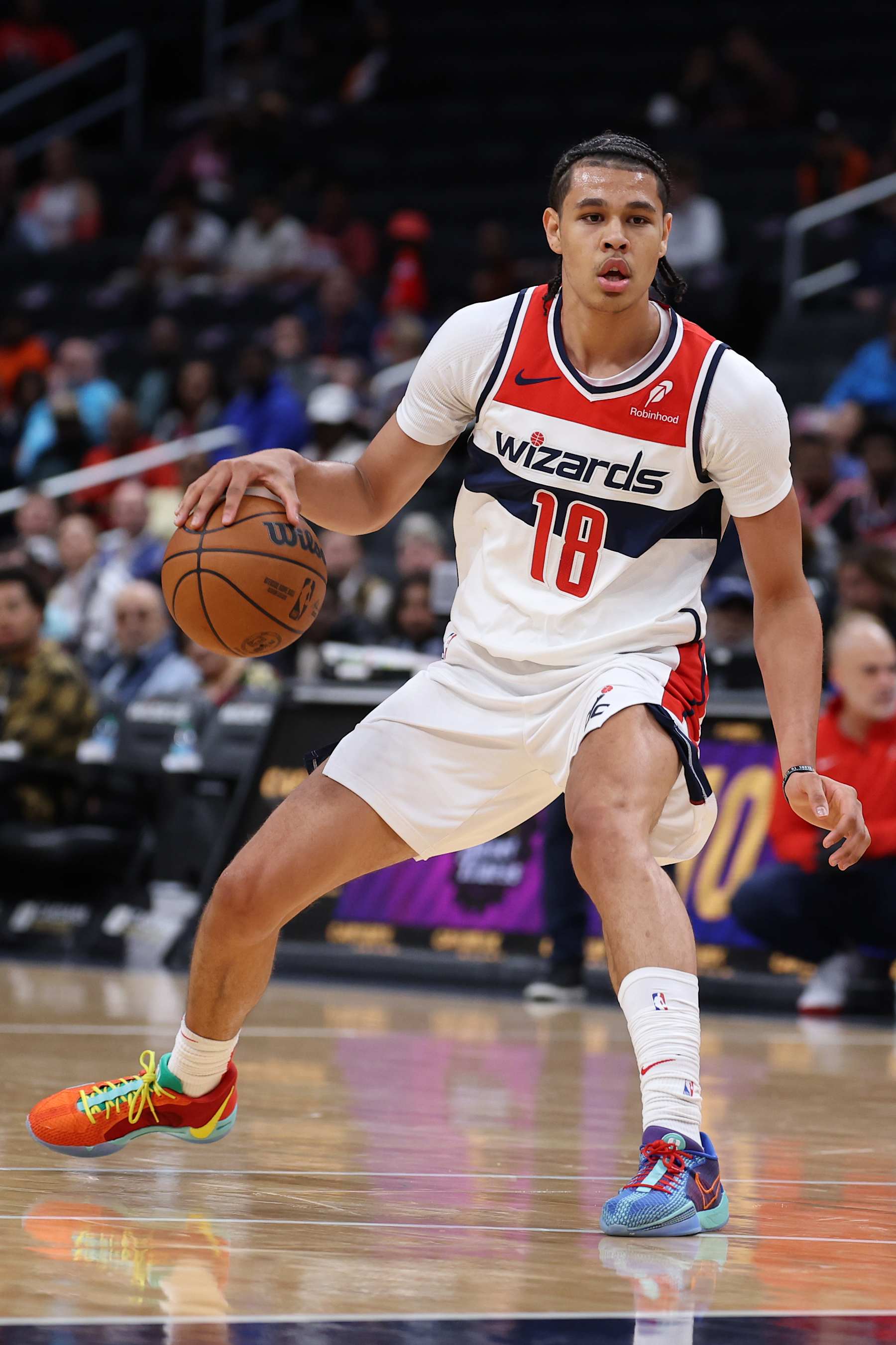 WASHINGTON, DC - OCTOBER 11: Kyshawn George #18 of the Washington Wizards dribbles the ball against the Toronto Raptors during the first half of a preseason game at Capital One Arena on October 11, 2024 in Washington, DC. NOTE TO USER: User expressly acknowledges and agrees that, by downloading and or using this photograph, User is consenting to the terms and conditions of the Getty Images License Agreement. (Photo by Patrick Smith/Getty Images)