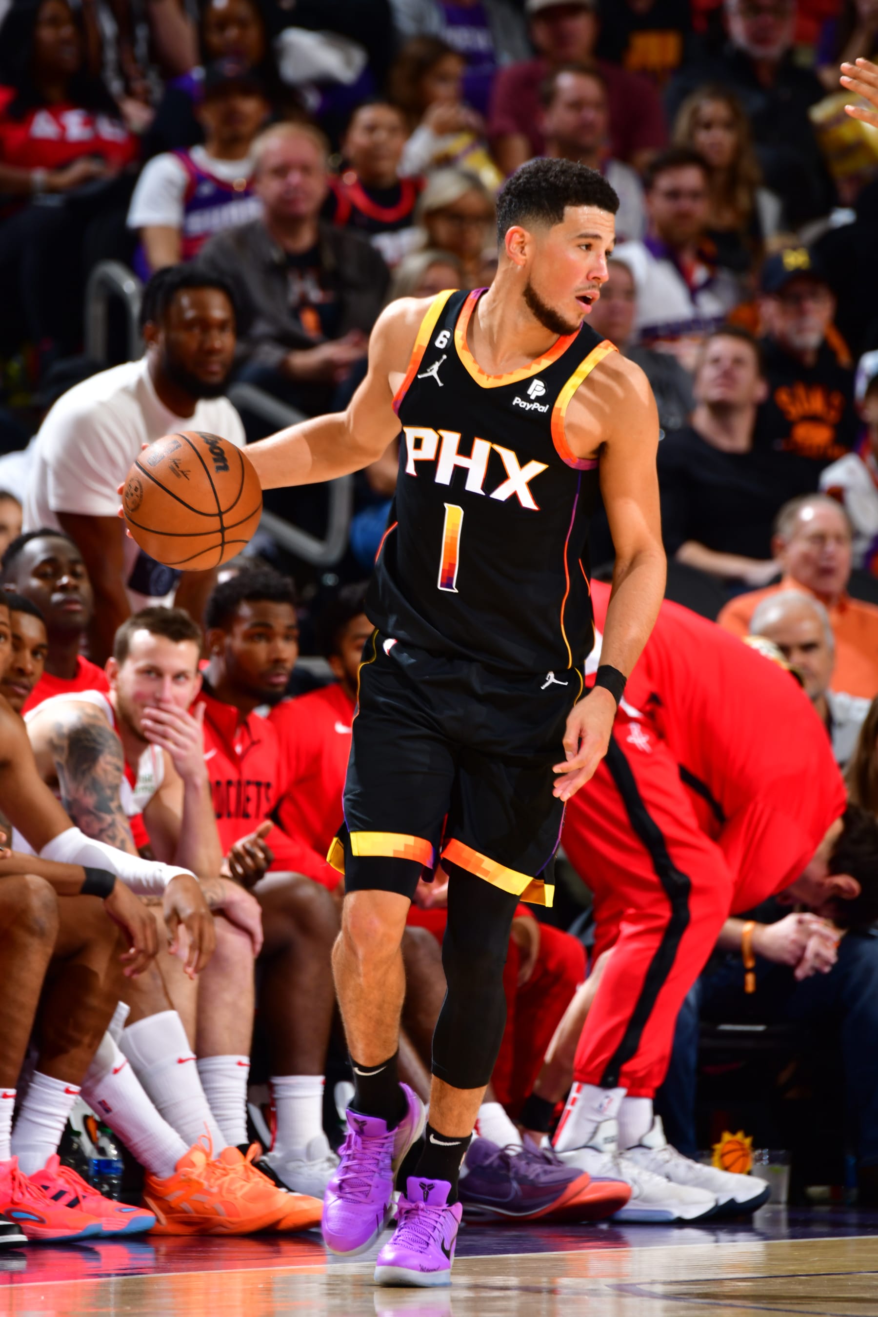 PHOENIX, AZ - OCTOBER 30: Devin Booker #1 of the Phoenix Suns handles the ball during the game against the Houston Rockets on October 30, 2022 at Footprint Center in Phoenix, Arizona. NOTE TO USER: User expressly acknowledges and agrees that, by downloading and or using this photograph, user is consenting to the terms and conditions of the Getty Images License Agreement. Mandatory Copyright Notice: Copyright 2022 NBAE (Photo by Barry Gossage/NBAE via Getty Images)