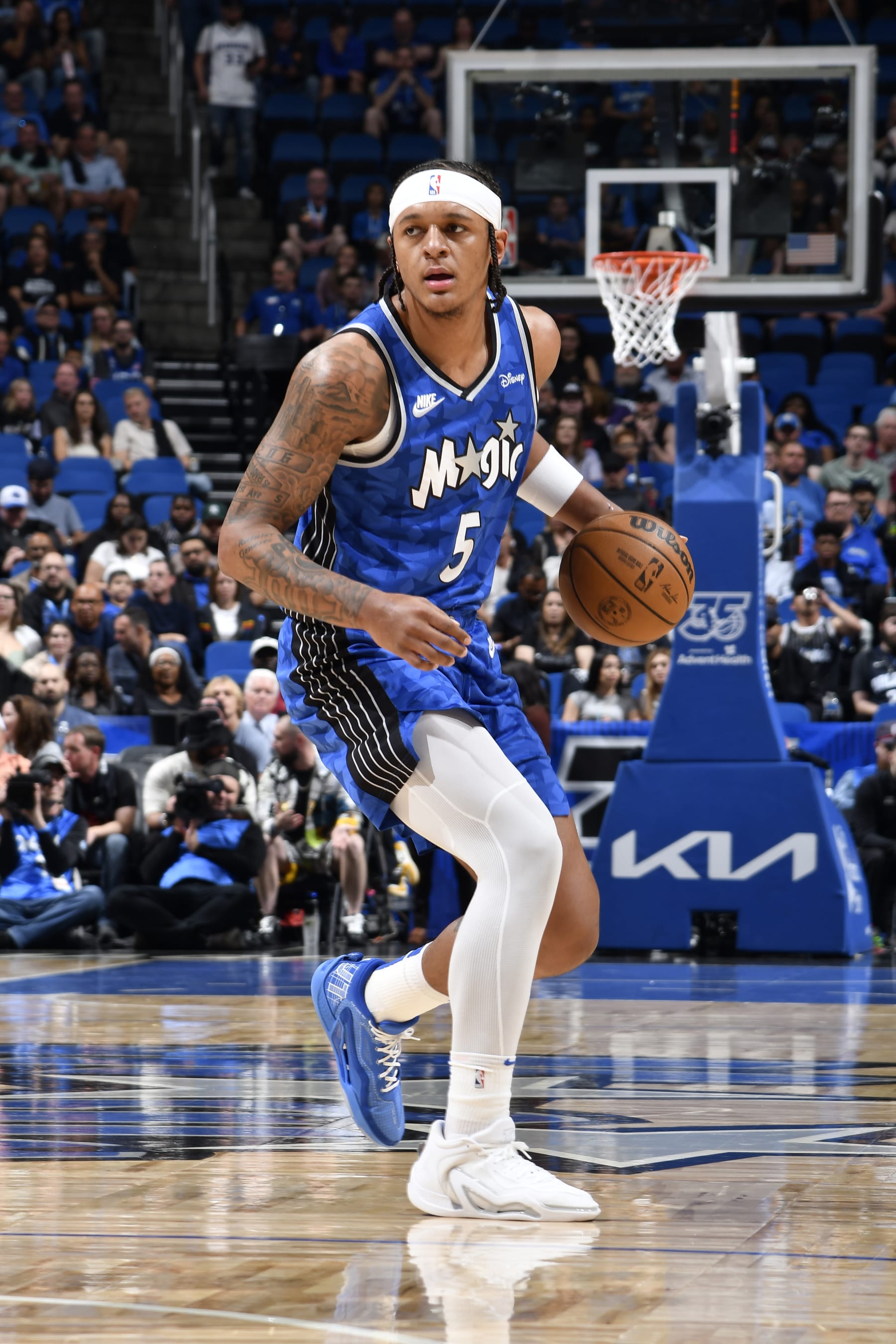 ORLANDO, FL - MARCH 23: Paolo Banchero #5 of the Orlando Magic handles the ball during the game against the Sacramento Kings on March 23, 2024 at the Kia Center in Orlando, Florida. NOTE TO USER: User expressly acknowledges and agrees that, by downloading and or using this photograph, User is consenting to the terms and conditions of the Getty Images License Agreement. Mandatory Copyright Notice: Copyright 2024 NBAE (Photo by Fernando Medina/NBAE via Getty Images)