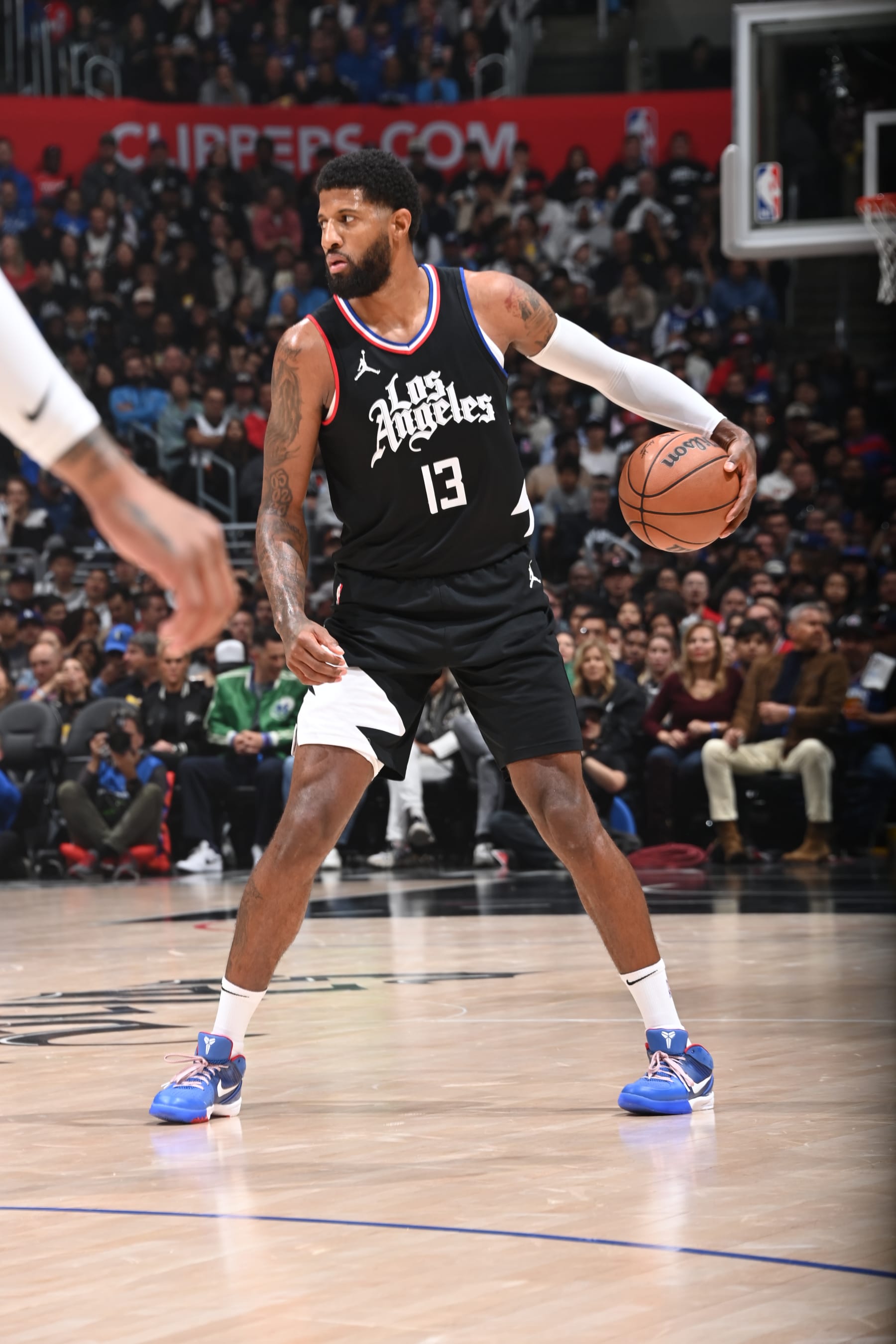 LOS ANGELES, CA - APRIL 23: Paul George #13 of the LA Clippers dribbles the ball during the game against the Dallas Mavericks during Round 1 Game 2 of the 2024 NBA Playoffs on April 23, 2024 at Crypto.Com Arena in Los Angeles, California. NOTE TO USER: User expressly acknowledges and agrees that, by downloading and/or using this Photograph, user is consenting to the terms and conditions of the Getty Images License Agreement. Mandatory Copyright Notice: Copyright 2024 NBAE (Photo by Andrew D. Bernstein/NBAE via Getty Images) LOS ANGELES, CA - APRIL 23: Paul George #13 of the LA Clippers dribbles the ball during the game against the Dallas Mavericks during Round 1 Game 2 of the 2024 NBA Playoffs on April 23, 2024 at Crypto.Com Arena in Los Angeles, California. NOTE TO USER: User expressly acknowledges and agrees that, by downloading and/or using this Photograph, user is consenting to the terms and conditions of the Getty Images License Agreement. Mandatory Copyright Notice: Copyright 2024 NBAE (Photo by Andrew D. Bernstein/NBAE via Getty Images)