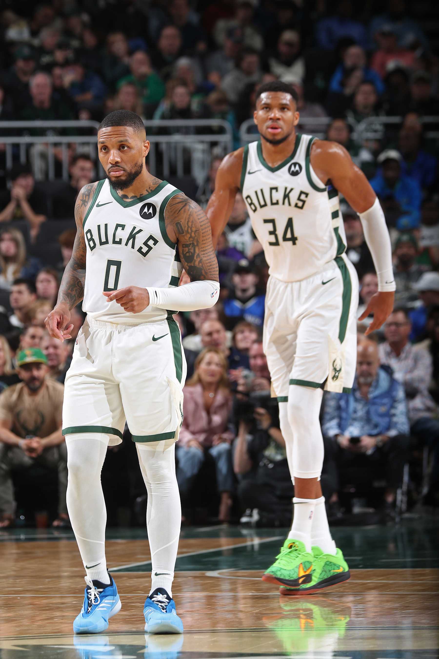 MILWAUKEE, WI - NOVEMBER 7: Damian Lillard #0 and Giannis Antetokounmpo #34 of the Milwaukee Bucks look on during the game against the Utah Jazz on November 7, 2024 at Fiserv Forum Center in Milwaukee, Wisconsin. NOTE TO USER: User expressly acknowledges and agrees that, by downloading and or using this Photograph, user is consenting to the terms and conditions of the Getty Images License Agreement. Mandatory Copyright Notice: Copyright 2024 NBAE (Photo by Gary Dineen/NBAE via Getty Images).