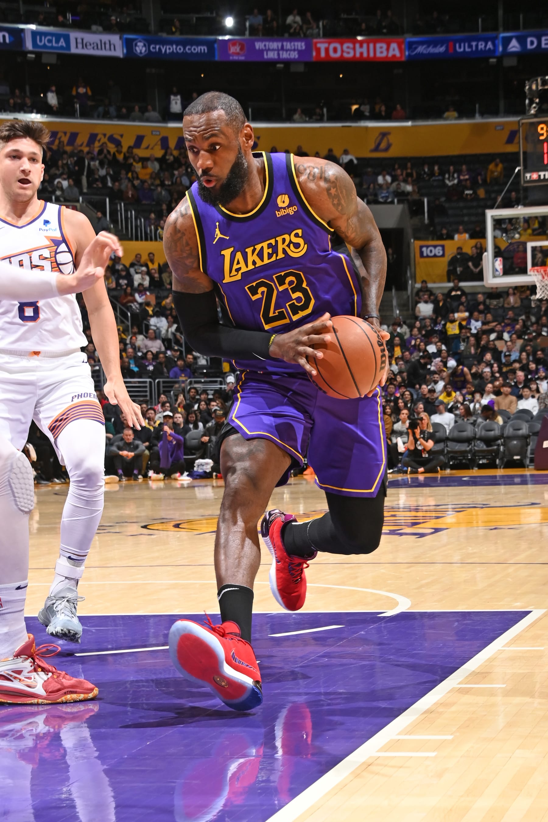 LOS ANGELES, CA - JANUARY 11: LeBron James #23 of the Los Angeles Lakers handles the ball during the game against the Phoenix Suns on January 11, 2024 at Crypto.Com Arena in Los Angeles, California. NOTE TO USER: User expressly acknowledges and agrees that, by downloading and/or using this Photograph, user is consenting to the terms and conditions of the Getty Images License Agreement. Mandatory Copyright Notice: Copyright 2024 NBAE (Photo by Andrew D. Bernstein/NBAE via Getty Images)