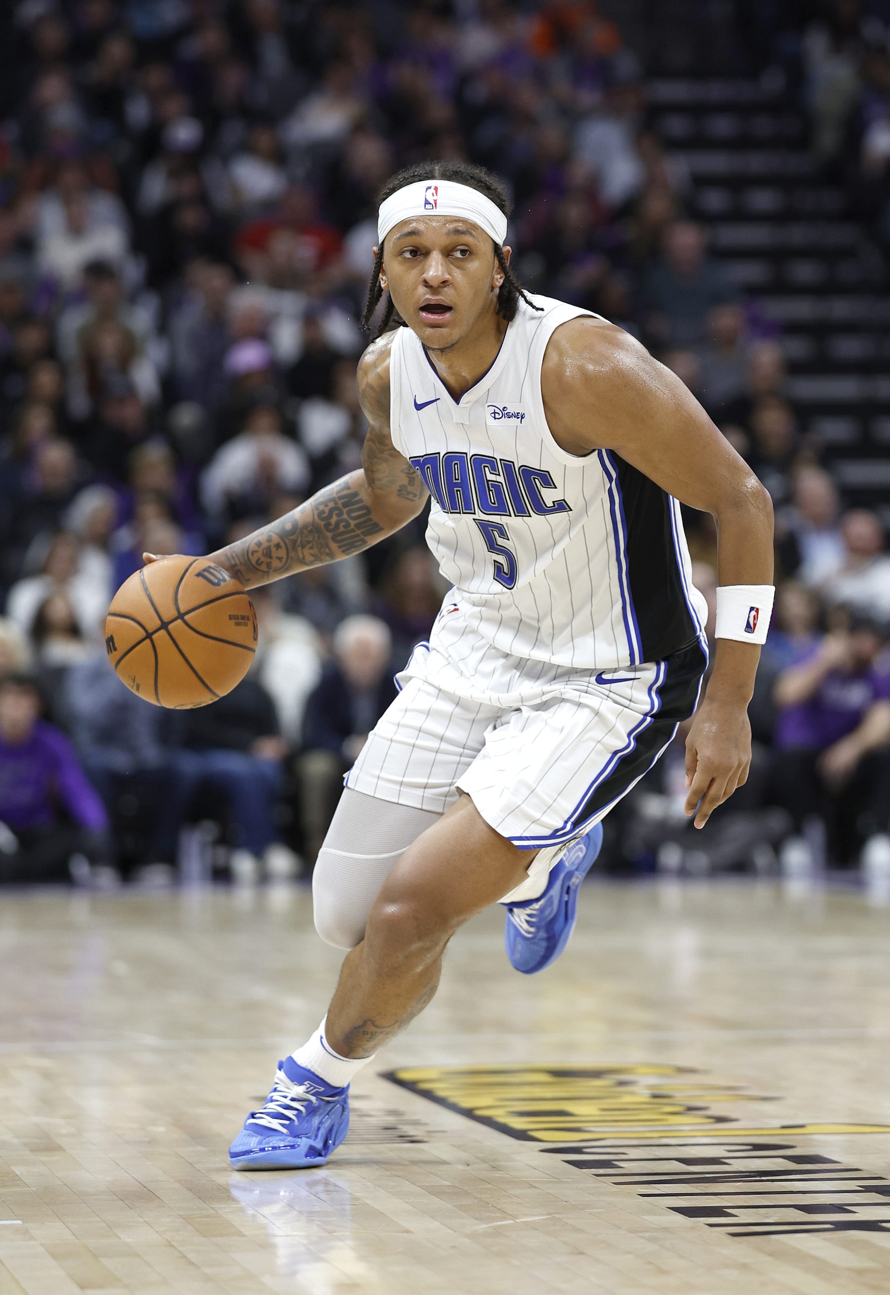 SACRAMENTO, CALIFORNIA - JANUARY 03: Paolo Banchero #5 of the Orlando Magic dribbles the ball against the Sacramento Kings during the second half of an NBA basketball game at Golden 1 Center on January 03, 2024 in Sacramento, California. NOTE TO USER: User expressly acknowledges and agrees that, by downloading and or using this photograph, User is consenting to the terms and conditions of the Getty Images License Agreement. (Photo by Thearon W. Henderson/Getty Images)