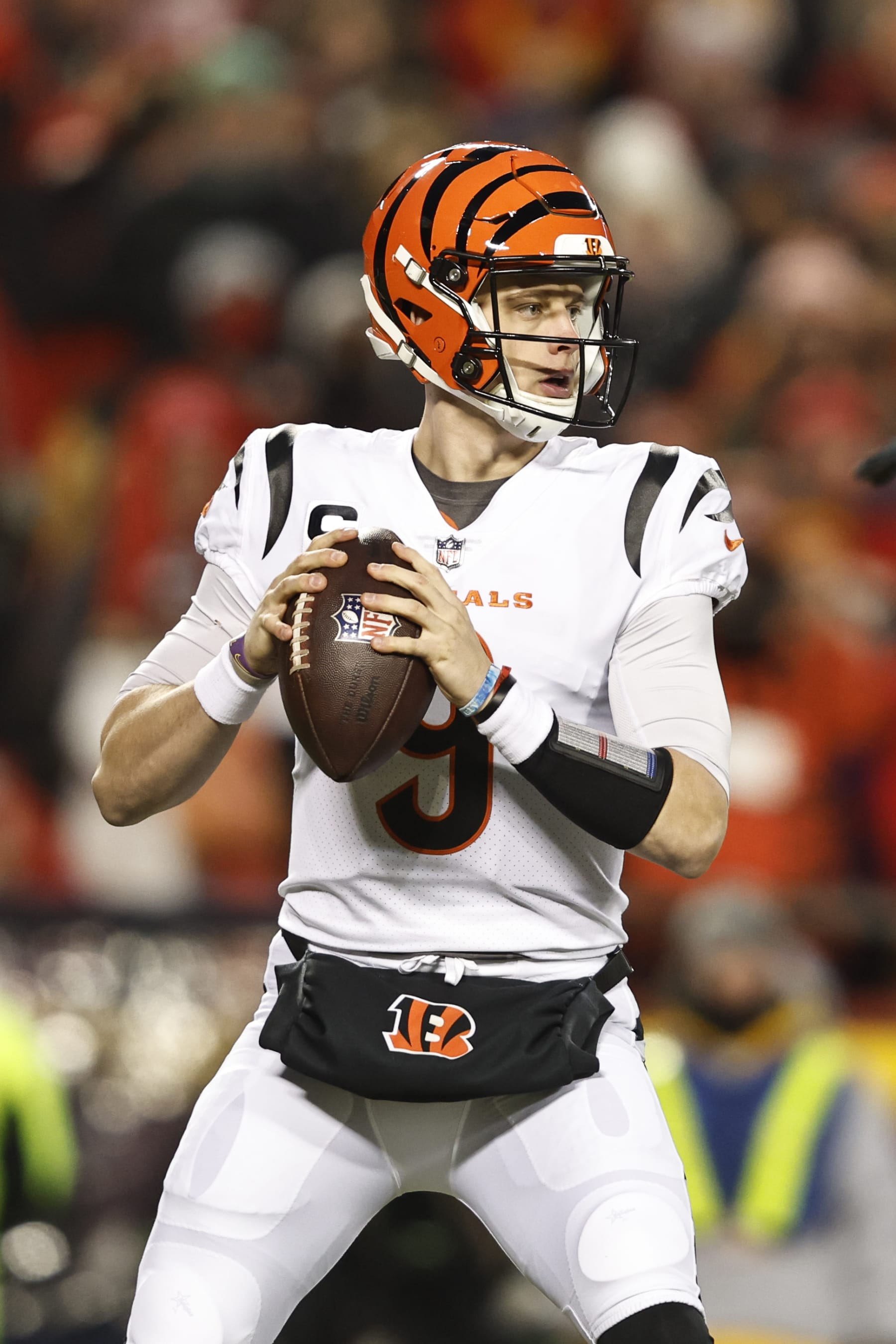 KANSAS CITY, MISSOURI - JANUARY 29: Joe Burrow #9 of the Cincinnati Bengals drops back to pass during the AFC Championship NFL football game between the Kansas City Chiefs and the Cincinnati Bengals at GEHA Field at Arrowhead Stadium on January 29, 2023 in Kansas City, Missouri. (Photo by Michael Owens/Getty Images)