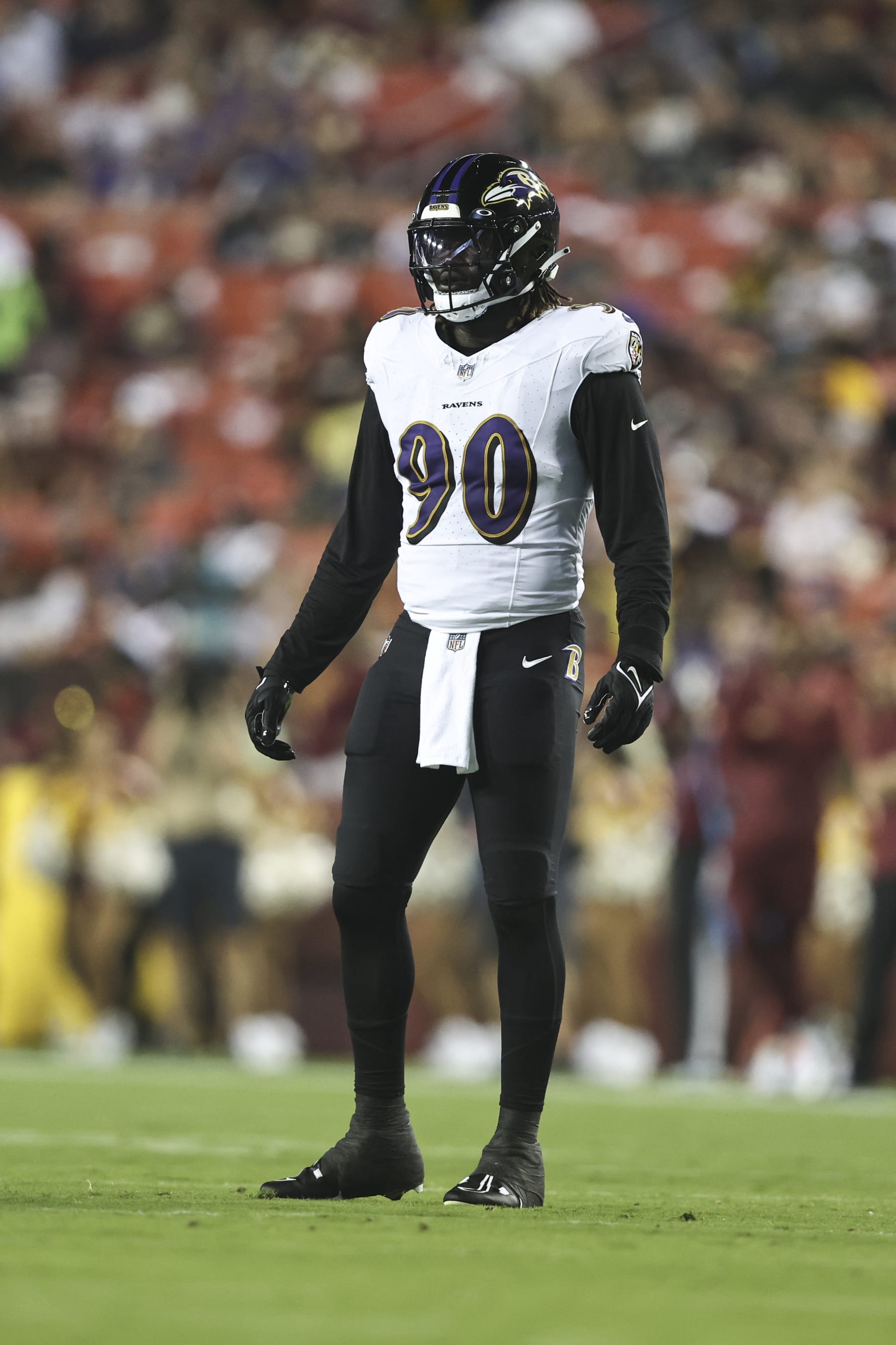 LANDOVER, MARYLAND - AUGUST 21: David Ojabo #90 of the Baltimore Ravens looks on during an NFL preseason game between the Washington Commanders and the Baltimore Ravens at FedExField on August 21, 2023 in Landover, Maryland. (Photo by Michael Owens/Getty Images)