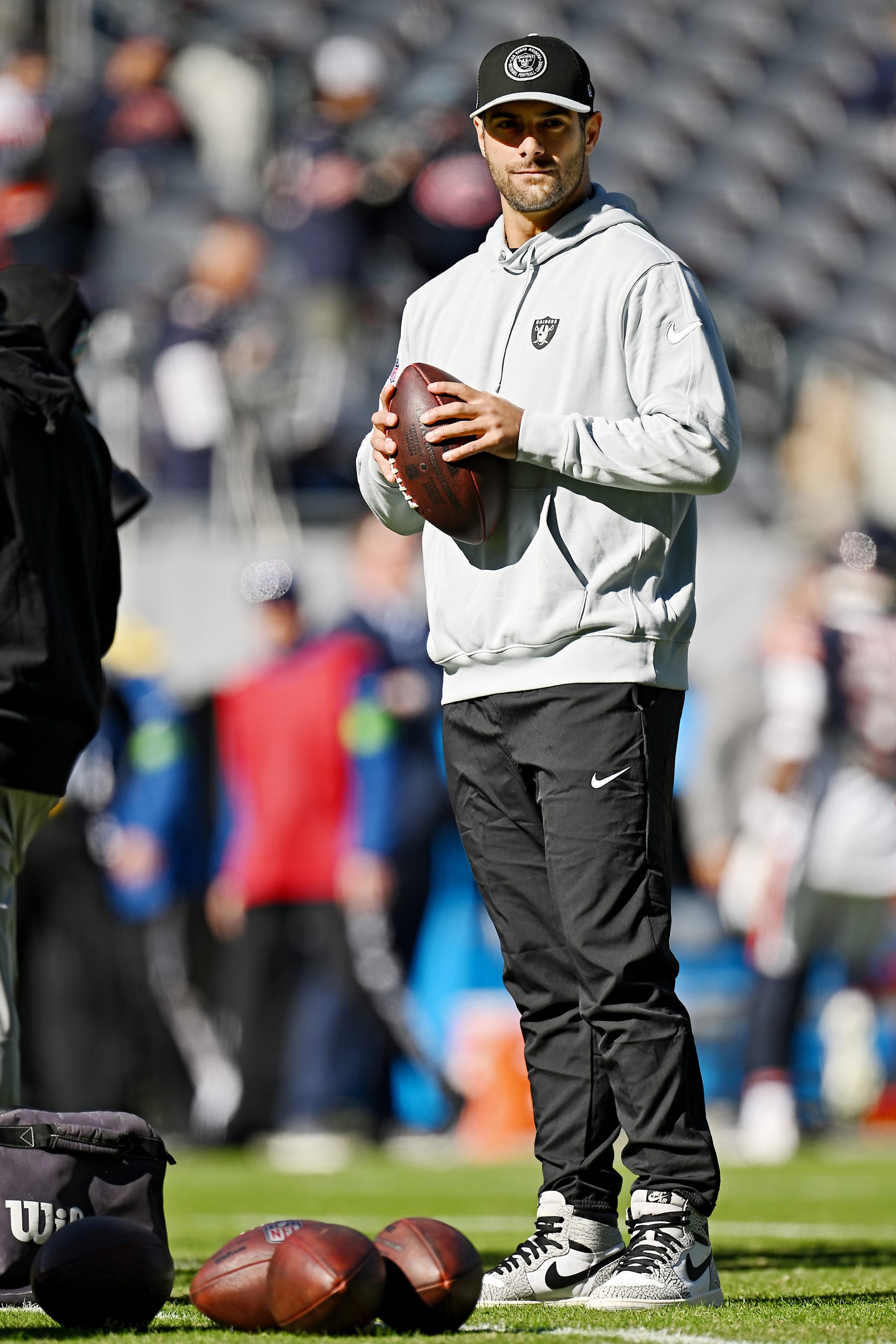 CHICAGO, ILLINOIS - OCTOBER 22: Jimmy Garoppolo #10 of the Las Vegas Raiders walks the field before the game against the Chicago Bears at Soldier Field on October 22, 2023 in Chicago, Illinois. (Photo by Quinn Harris/Getty Images)