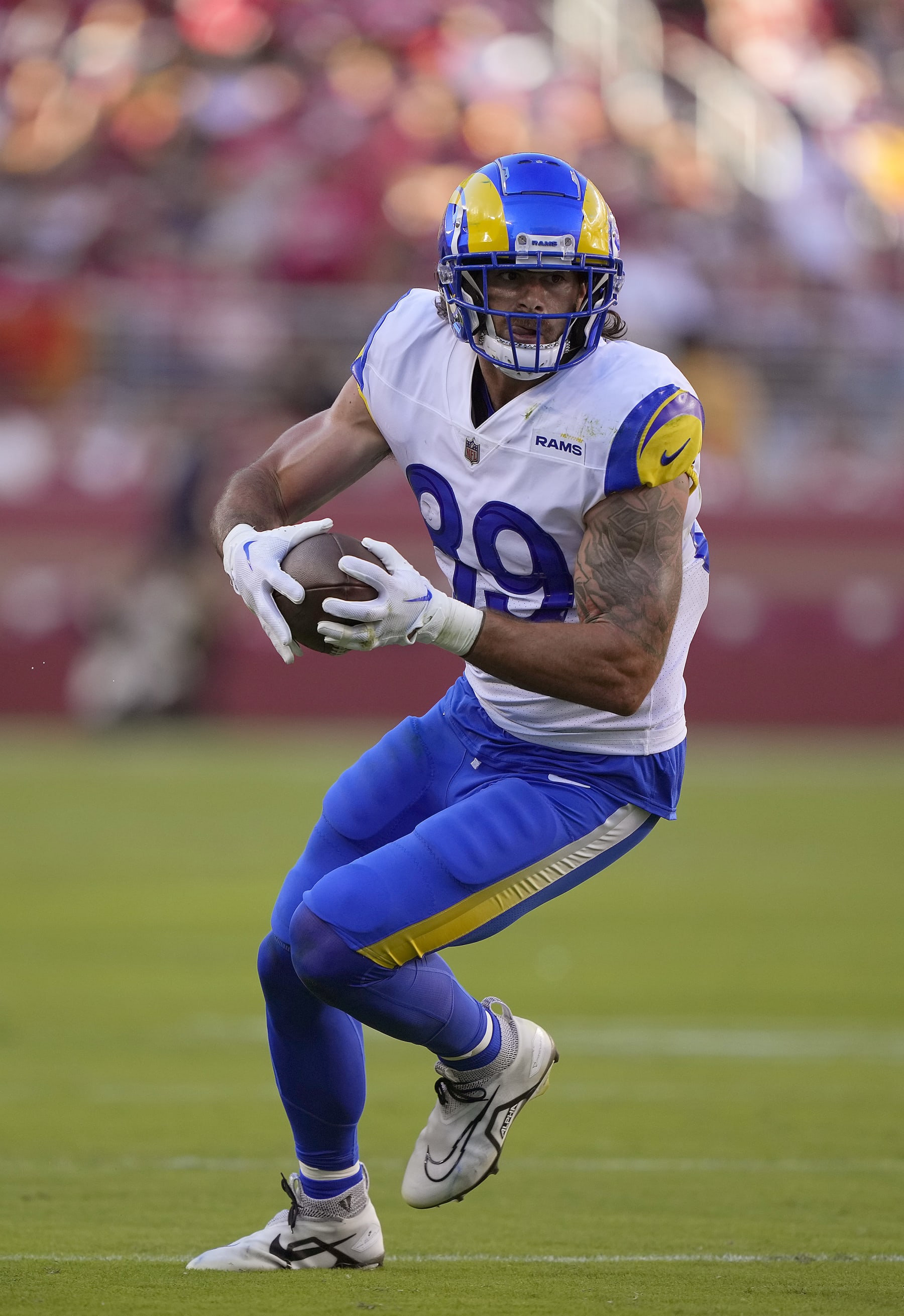 SANTA CLARA, CALIFORNIA - OCTOBER 03: Tight end Tyler Higbee #89 of the Los Angeles Rams runs with the ball after making a catch against the San Francisco 49ers during the first quarter at Levi's Stadium on October 03, 2022 in Santa Clara, California. (Photo by Thearon W. Henderson/Getty Images)