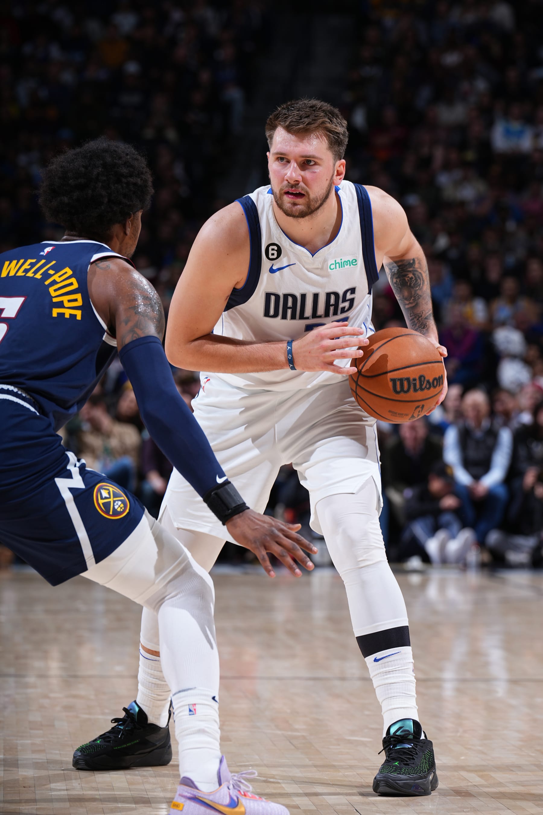 DENVER, CO - DECEMBER 6: Luka Doncic #77 of the Dallas Mavericks dribbles the ball during the game against the Denver Nuggets on December 6, 2022 at the Ball Arena in Denver, Colorado. NOTE TO USER: User expressly acknowledges and agrees that, by downloading and/or using this Photograph, user is consenting to the terms and conditions of the Getty Images License Agreement. Mandatory Copyright Notice: Copyright 2022 NBAE (Photo by Garrett Ellwood/NBAE via Getty Images)