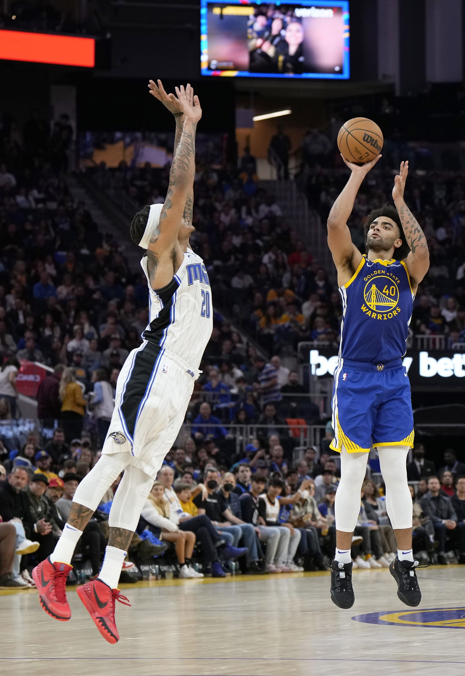 SAN FRANCISCO, CALIFORNIA - JANUARY 07: Anthony Lamb #40 of the Golden State Warriors shoots a three-point shot over Markelle Fultz #20 of the Orlando Magic in the third quarter at Chase Center on January 07, 2023 in San Francisco, California. NOTE TO USER: User expressly acknowledges and agrees that, by downloading and or using this photograph, User is consenting to the terms and conditions of the Getty Images License Agreement. (Photo by Thearon W. Henderson/Getty Images)