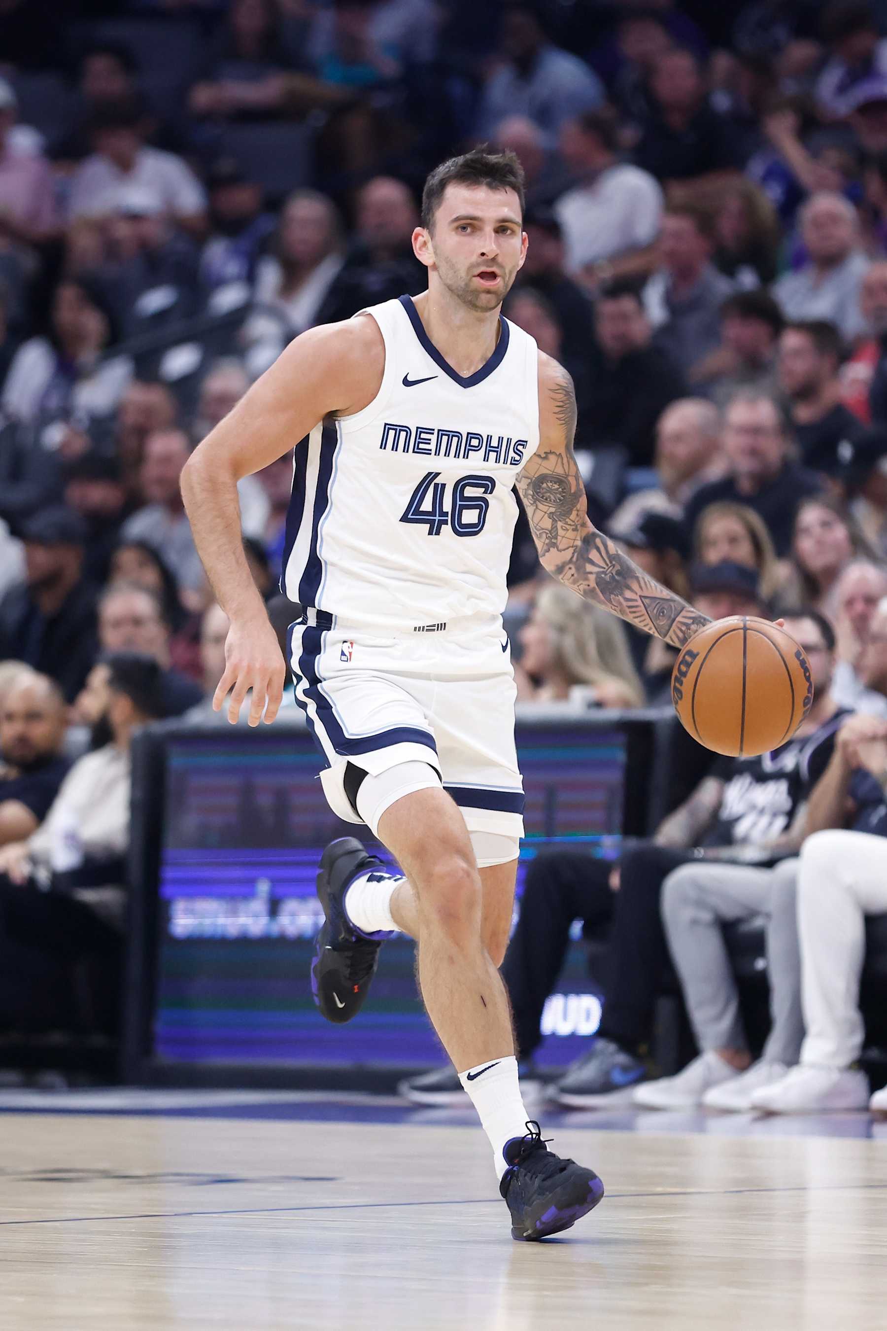 SACRAMENTO, CALIFORNIA - MARCH 18: John Konchar #46 of the Memphis Grizzlies dribbles the ball in the first quarter against the Sacramento Kings at Golden 1 Center on March 18, 2024 in Sacramento, California. NOTE TO USER: User expressly acknowledges and agrees that, by downloading and or using this photograph, User is consenting to the terms and conditions of the Getty Images License Agreement. (Photo by Lachlan Cunningham/Getty Images)