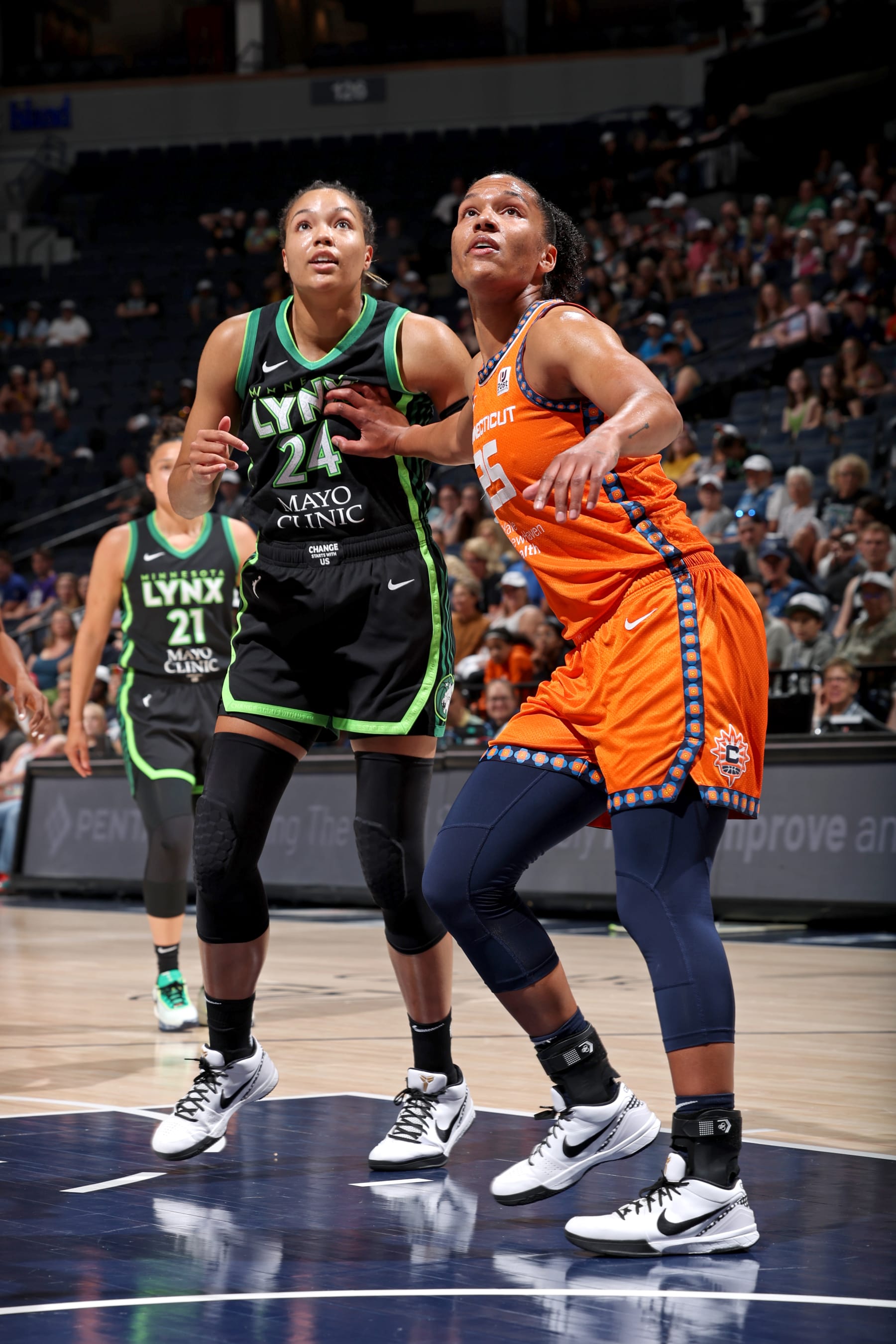 MINNEAPOLIS, MN -  JUNE 22: Alyssa Thomas #25 of the Connecticut Sun and Napheesa Collier #24 of the Minnesota Lynx battle for position during the game on June 22, 2023 at Target Center in Minneapolis, Minnesota. NOTE TO USER: User expressly acknowledges and agrees that, by downloading and or using this Photograph, user is consenting to the terms and conditions of the Getty Images License Agreement. Mandatory Copyright Notice: Copyright 2023 NBAE (Photo by David Sherman/NBAE via Getty Images)