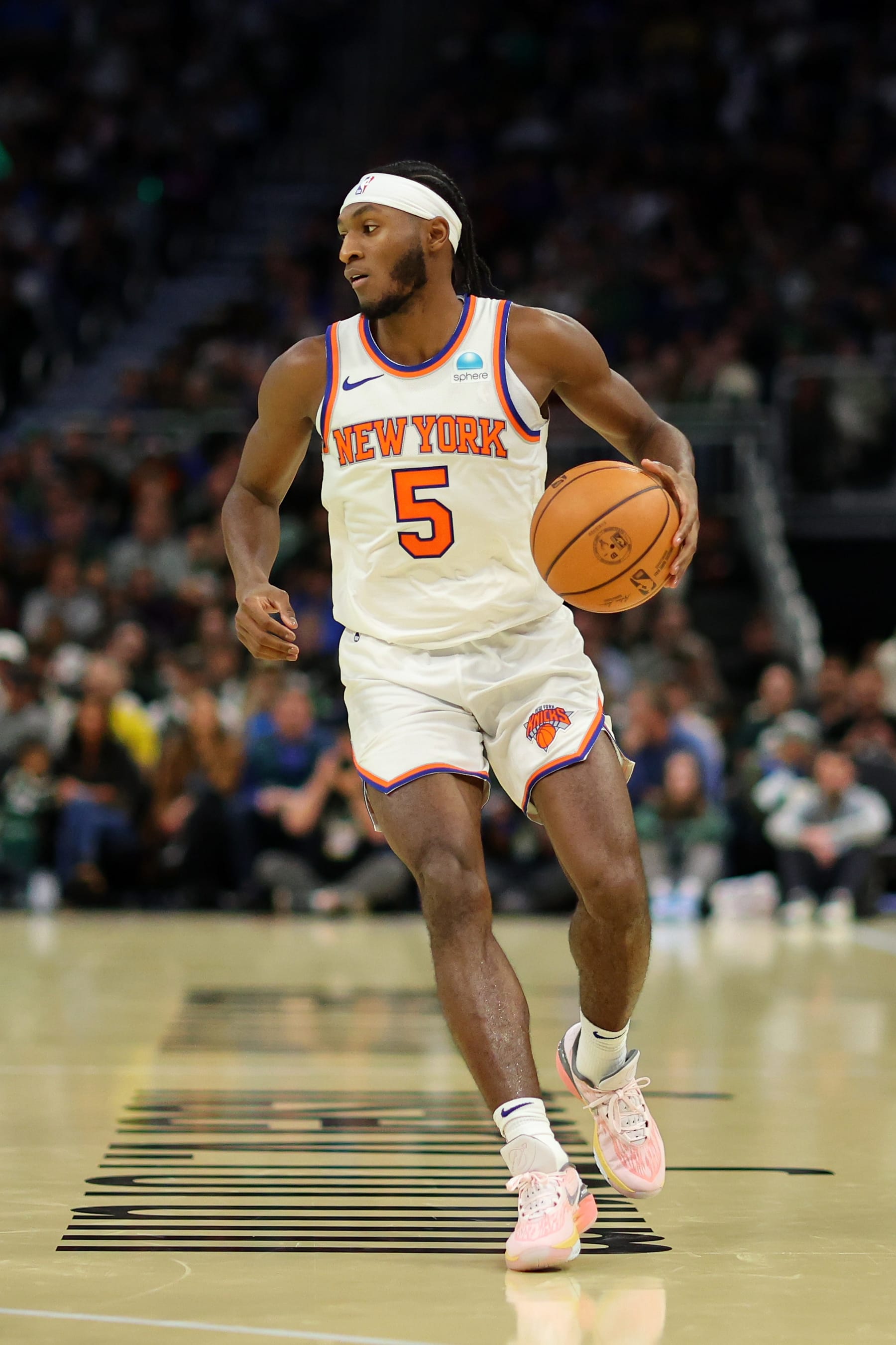 MILWAUKEE, WISCONSIN - DECEMBER 05: Immanuel Quickley #5 of the New York Knicks handles the ball against the Milwaukee Bucks during the NBA In-Season Tournament Quarterfinal at Fiserv Forum on December 05, 2023 in Milwaukee, Wisconsin. NOTE TO USER: User expressly acknowledges and agrees that, by downloading and or using this photograph, User is consenting to the terms and conditions of the Getty Images License Agreement. (Photo by Stacy Revere/Getty Images)