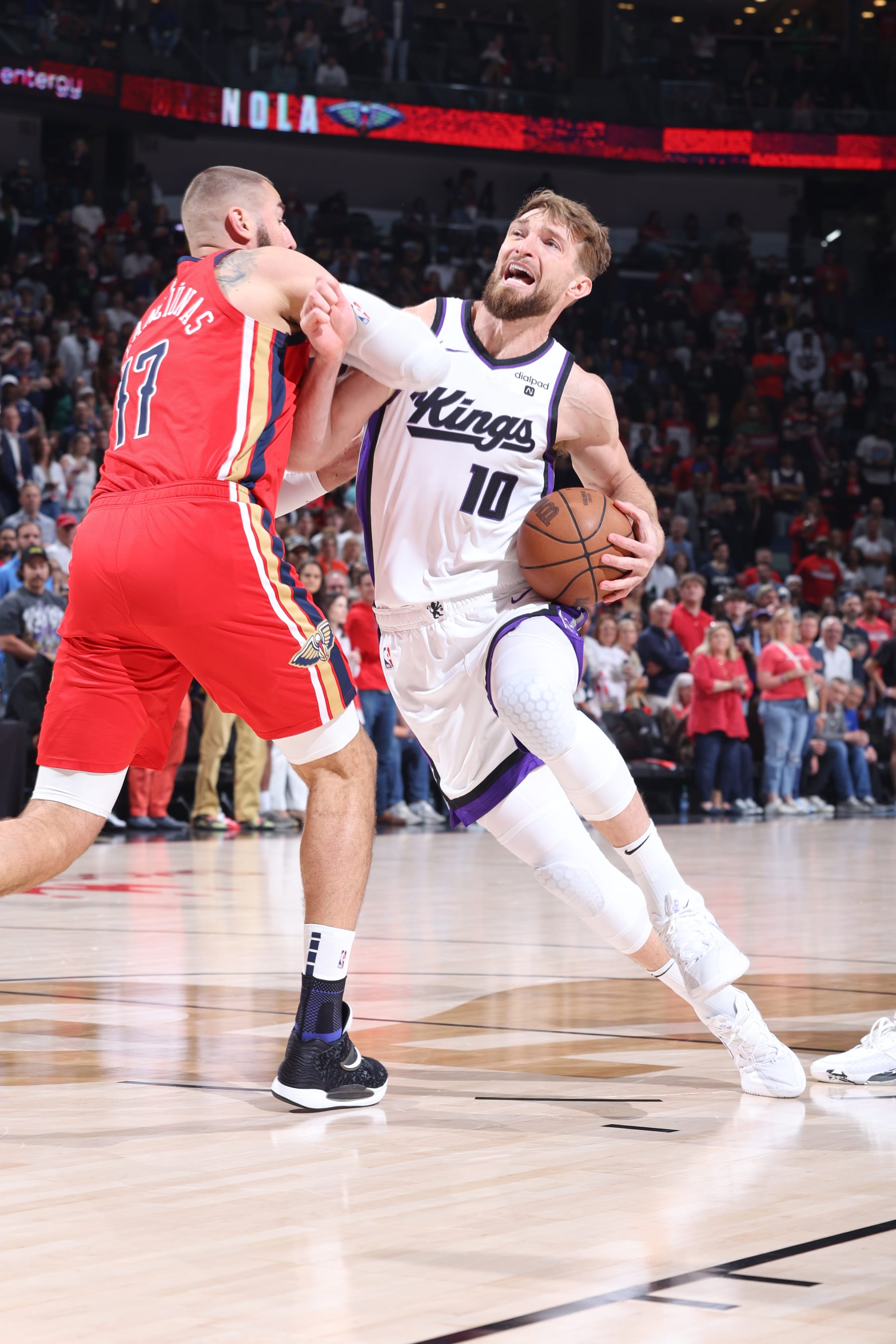NEW ORLEANS, LA - APRIL 19:  Domantas Sabonis #10 of the Sacramento Kings goes to the basket during the game against the New Orleans Pelicans during the 2024 Play-In Tournament on April 19, 2024 at the Smoothie King Center in New Orleans, Louisiana. NOTE TO USER: User expressly acknowledges and agrees that, by downloading and or using this Photograph, user is consenting to the terms and conditions of the Getty Images License Agreement. Mandatory Copyright Notice: Copyright 2024 NBAE (Photo by Jeff Haynes./NBAE via Getty Images)