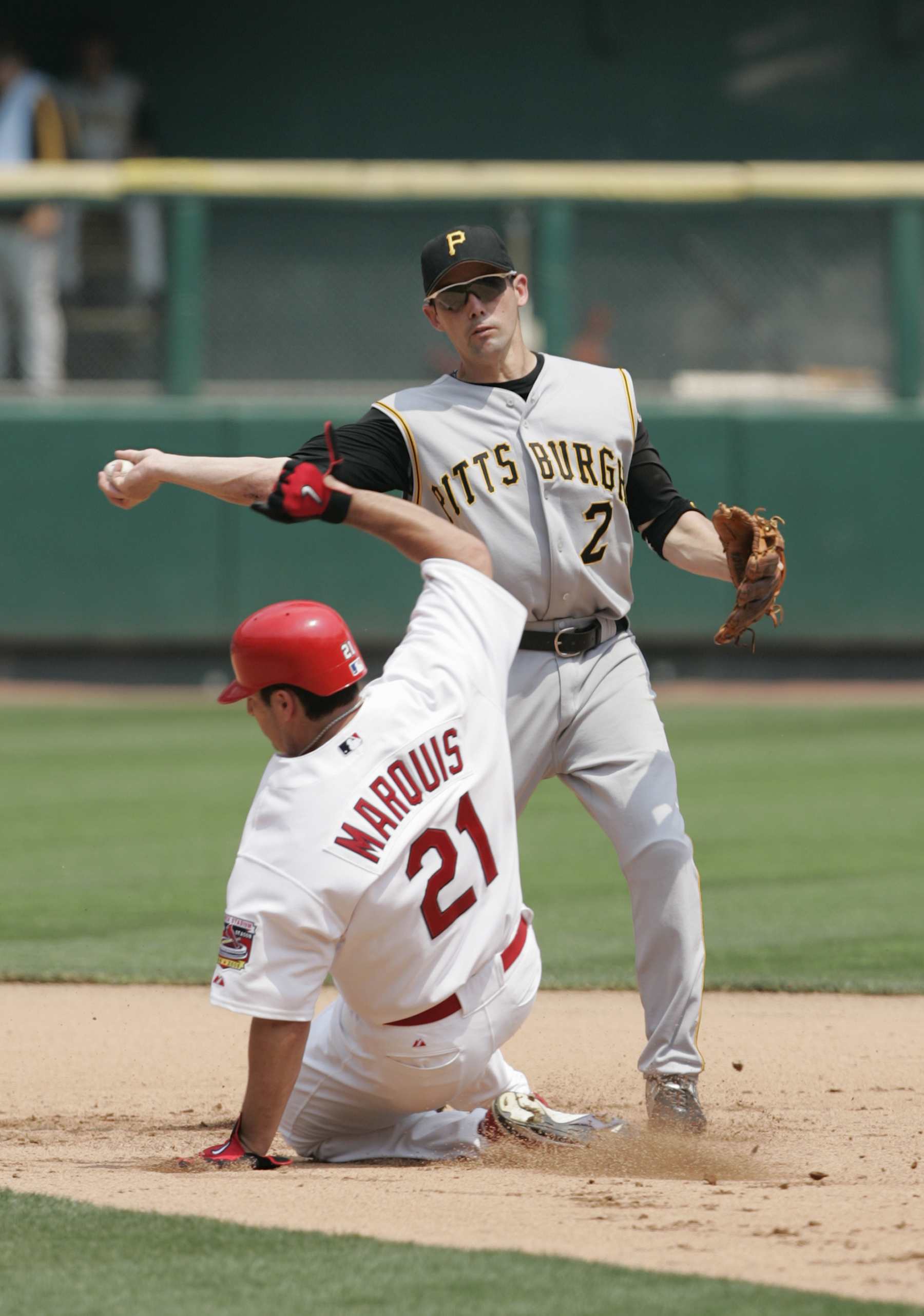 ST. LOUIS - June 26:  Jack Wilson #2 of the Pittsburgh Pirates looks to make a double play as Jason Marquis #21 of the St. Louis Cardinals slides into the base during the MLB game at Busch Stadium on June 26, 2005 in St. Louis, Missouri. The Pirates defeated the Cardinals 5-4.  (Photo by Dilip Vishwanat/Getty Images)