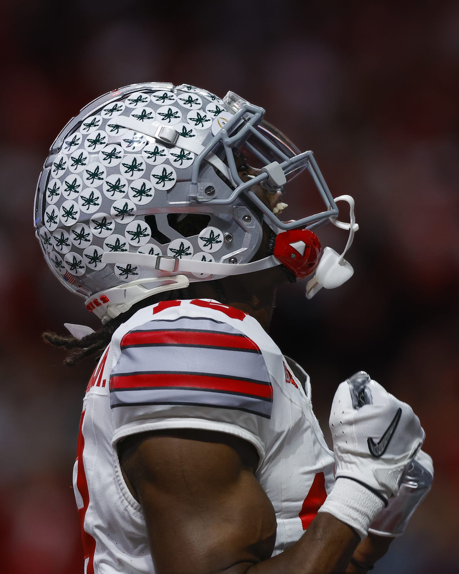 ATLANTA, GA - DECEMBER 31: Marvin Harrison Jr. #18 of the Ohio State Buckeyes reacts after a touchdown during the first half against the Georgia Bulldogs in the Chick-fil-A Peach Bowl at Mercedes-Benz Stadium on December 31, 2022 in Atlanta, Georgia. (Photo by Todd Kirkland/Getty Images)