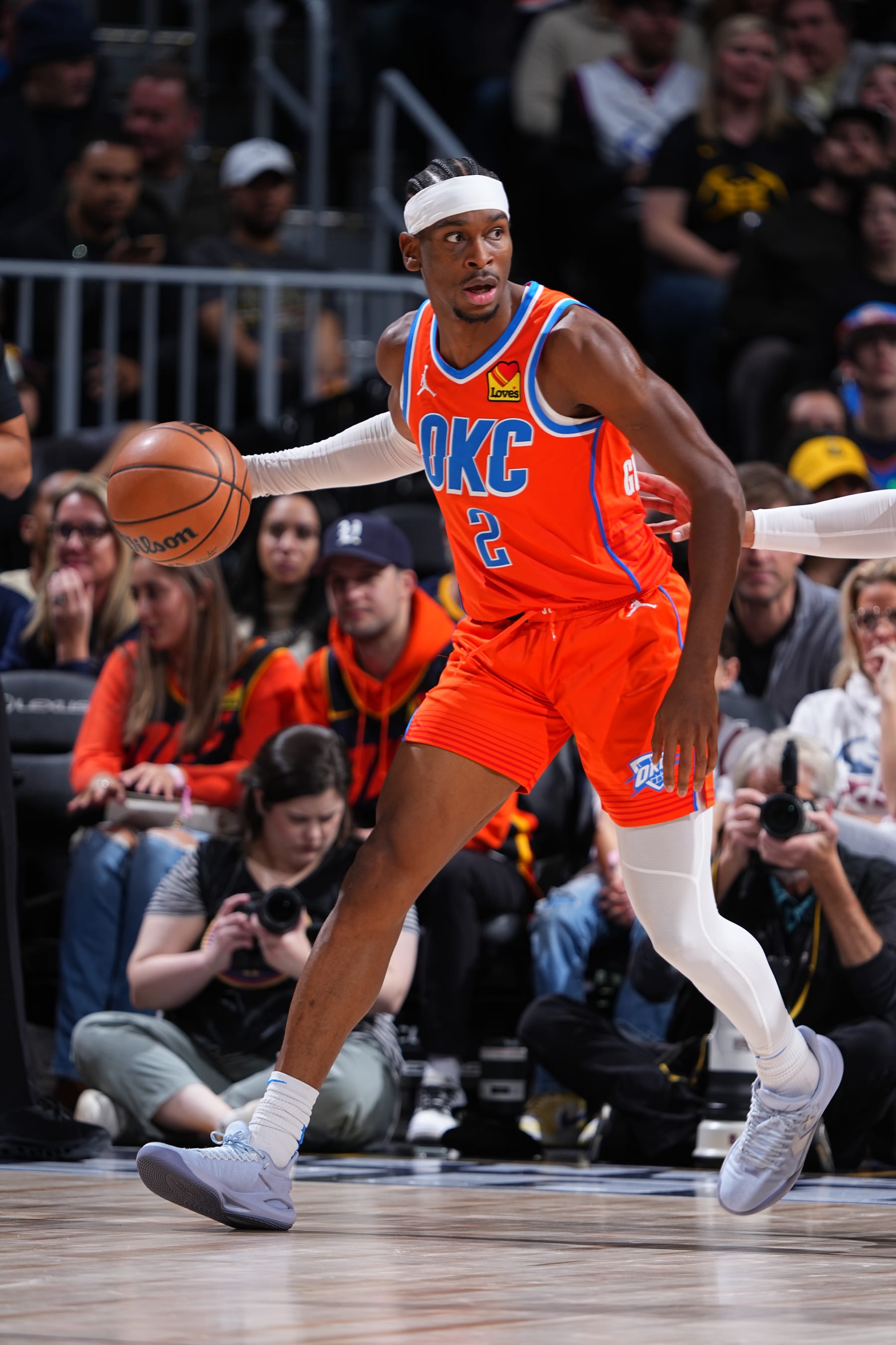 DENVER, CO - DECEMBER 16: Shai Gilgeous-Alexander #2 of the Oklahoma City Thunder dribbles the ball during the game against the Denver Nuggets on December 16, 2023 at the Ball Arena in Denver, Colorado. NOTE TO USER: User expressly acknowledges and agrees that, by downloading and/or using this Photograph, user is consenting to the terms and conditions of the Getty Images License Agreement. Mandatory Copyright Notice: Copyright 2023 NBAE (Photo by Garrett Ellwood/NBAE via Getty Images)