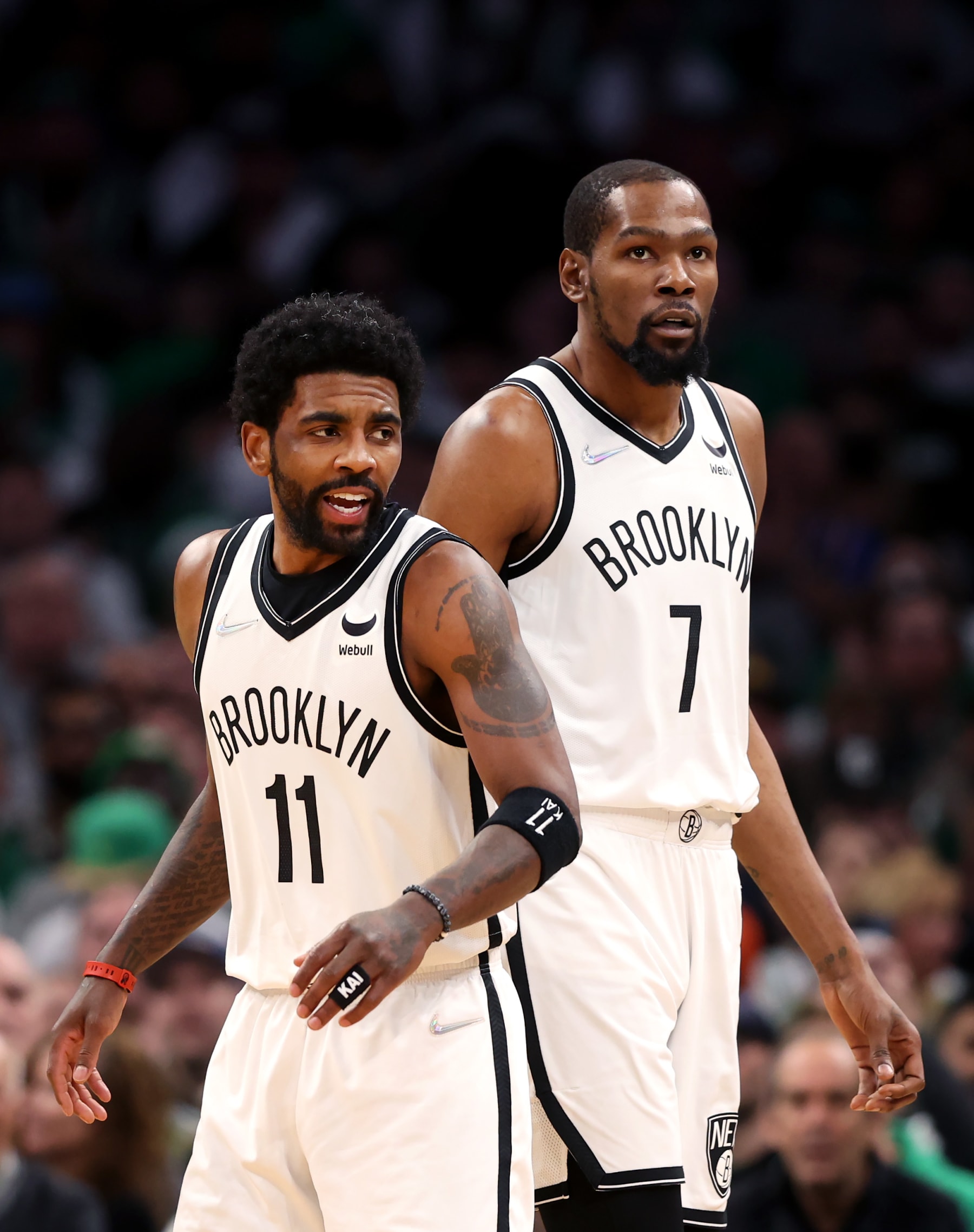 BOSTON, MASSACHUSETTS - APRIL 17: Kyrie Irving #11 of the Brooklyn Nets and Kevin Durant #7 look on during the first quarter of Round 1 Game 1 of the 2022 NBA Eastern Conference Playoffs against the Boston Celtics at TD Garden on April 17, 2022 in Boston, Massachusetts. (Photo by Maddie Meyer/Getty Images)