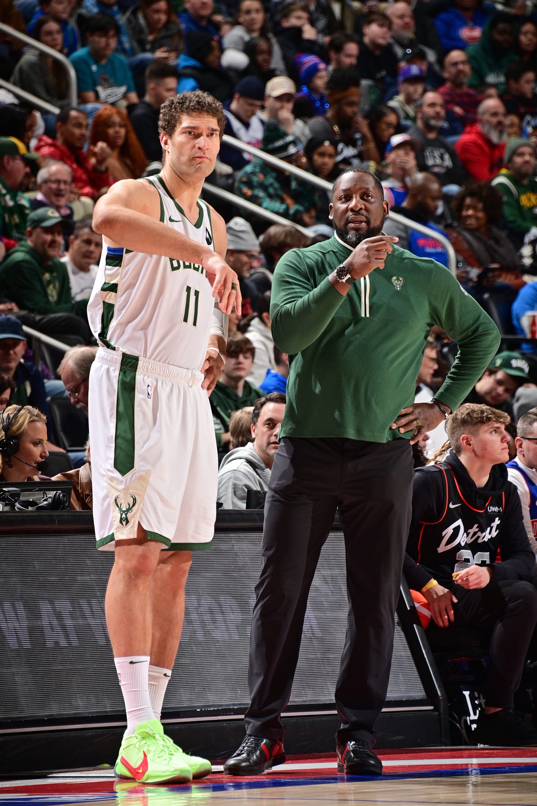 DETROIT, MI - JANUARY 20: Brook Lopez #11 and Head Coach Adrian Griffin of the Milwaukee Bucks talk during the game against the Detroit Pistons on January 20, 2024 at Little Caesars Arena in Detroit, Michigan. NOTE TO USER: User expressly acknowledges and agrees that, by downloading and/or using this photograph, User is consenting to the terms and conditions of the Getty Images License Agreement. Mandatory Copyright Notice: Copyright 2024 NBAE (Photo by Chris Schwegler/NBAE via Getty Images)