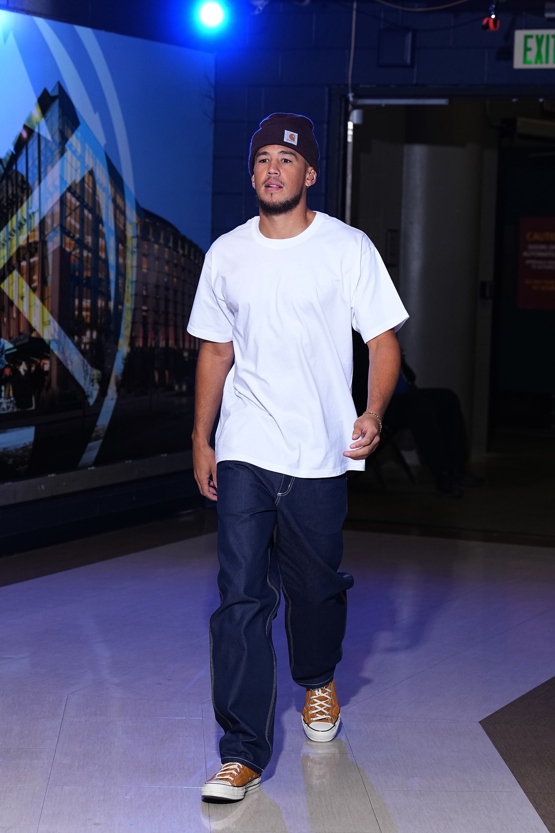 DENVER, CO - OCTOBER 10: Devin Booker #1 of the Phoenix Suns arrives to the arena before a preseason game against the Denver Nuggets on October 10, 2022 at the Ball Arena in Denver, Colorado. NOTE TO USER: User expressly acknowledges and agrees that, by downloading and/or using this Photograph, user is consenting to the terms and conditions of the Getty Images License Agreement. Mandatory Copyright Notice: Copyright 2022 NBAE (Photo by Garrett Ellwood/NBAE via Getty Images)
